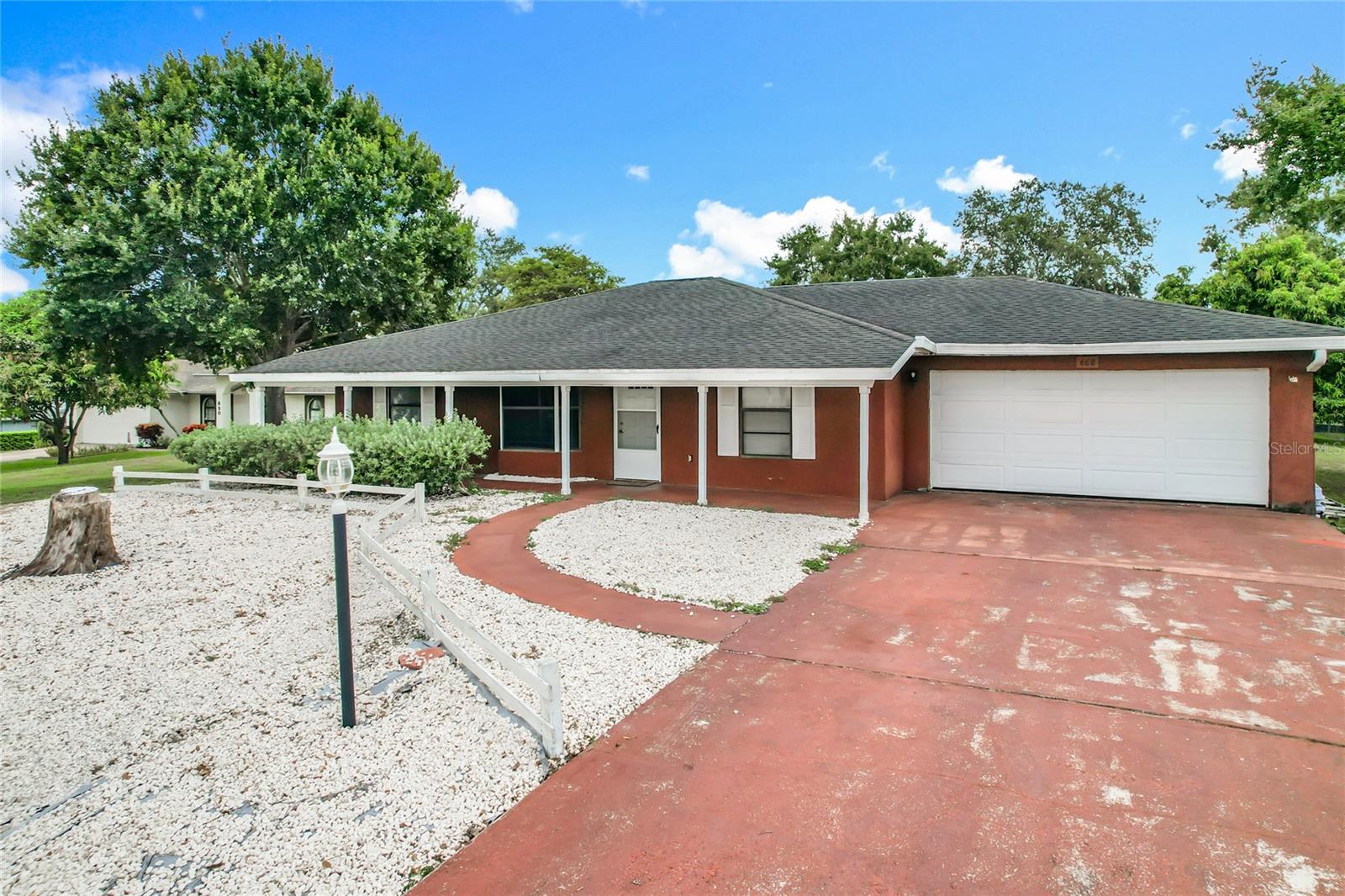 Move-in ready and full of charm! This 3-bedroom, 2 bath home offers over 1,200 sq ft of comfortable living on nearly half an acre, complete with a den used as a 4th bedroom and 2-car garage and peaceful views near Lake Clinch. Fresh, clean, and functional. The home features a solid 1988 build, spacious layout, and a massive yard perfect for entertaining, expansion, or outdoor living. Enjoy quiet living with no HOA, private well and septic, and plenty of space to grow. Whether you're a first-time buyer or looking to downsize into simplicity, this one is ready to go. Easy to show, schedule your private tour today!