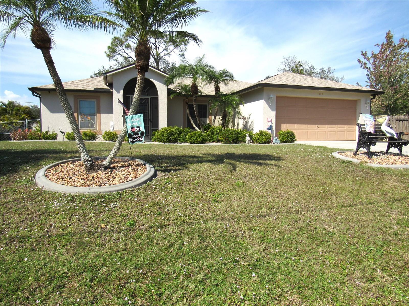 NEW PRICE!!! Very well maintained, 3 bedroom, 2 bath home in easily accessible North Port location! The open, split floorplan features beautiful upgraded laminate flooring, installed on the diagonal, throughout the home except for the kitchen, baths, and laundry room which have ceramic tile flooring. The living room, dining room and kitchen have vaulted ceilings. With sliders from the dining room, out to the nice sized lanai, you'll enjoy having your morning coffee overlooking the large, fenced back yard, which has an additional 17 x 12 paver patio. The kitchen, with a bay window, features a tile backsplash, newer stainless appliances, a reverse osmosis system on the kitchen sink plus a nice sized pantry. The ensuite primary bedroom features a bath with separated commode and glass enclosed shower area plus a large walk-in closet. The ROOF was replaced in 2022, IMPACT WINDOWS were installed in 2015, the garage door has been reinforced and insulated, the A/C was replaced in 2013. Additional insulation has recently been added above the garage. Need extra storage...a 13 x 10 shed will help with that. PUBLIC WATER and located in FLOOD ZONE X (no flood insurance required) and no HOA fees. All this and in a great location with easy access to I-75, near shopping, restaurants, golf, fishing, boating medical facilities, Cool Today Park (Spring training home of the Atlanta Braves) and approximately 1/2 hour from beaches on Manasota Key and Boca Grande.