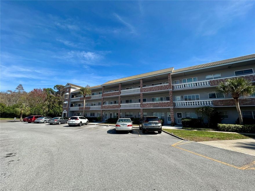 Enjoy the serenity of the scenic nature preserve from the comfort of your Florida Room in this beautifully furnished, 2 bed, 2 bath condo ideally situated on a quiet cul-de-sac. A rare, extra wide balcony bump out directly outside the front door provides the perfect spot for a small table and chairs, ideal for morning coffee or evening beverage.  Step inside to an expansive Living Room/Dining Room area featuring luxury vinyl plank flooring, wide baseboard molding, and smooth ceilings (no popcorn).  The tastefully updated kitchen is a true standout, offering slow close cabinetry with additional storage, granite countertops, ceramic tile backsplash, and ample prep space, making this kitchen a true delight for any home chef. The spacious primary suite provides comfort and privacy with an updated en-suite bath showcasing a modern vanity, updated commode, refreshed tile work, and contemporary lighting. The guest bathroom is equally impressive, featuring a second stall shower along with updated vanity, commode, tile, and lighting. All light switches and outlets have been replaced. The HVAC was replaced in 2018, and ceiling fans installed in all the main rooms to keep you cool. The windows have been updated and include marble sills, and the water heater was replaced in 2021. A washer and dryer are also included for your convenience.  Located in a vibrant and amenity-rich 55+ community, residents enjoy two private golf courses (9- and 18-hole), two heated swimming pools, two activity centers, and a remodeled fitness center. Stay active with pickleball, tennis, fitness classes, dancing, clubs, cards, and billiards. Pet lovers will appreciate the fenced dog park with covered seating. Creative residents can take advantage of hobby studios and a woodshop, while the on-site Good Karma Café offers convenient snacks and beverages. Conveniently located near Gulf Coast beaches, shopping, dining, entertainment, and transportation, this condo offers the perfect blend of peaceful living and active lifestyle. Property is conveyed by leasehold estate deed; association approval required. If financing, 35% down payment is required. Schedule your private showing today and start enjoying comfortable, maintenance-free living in an active and welcoming community!