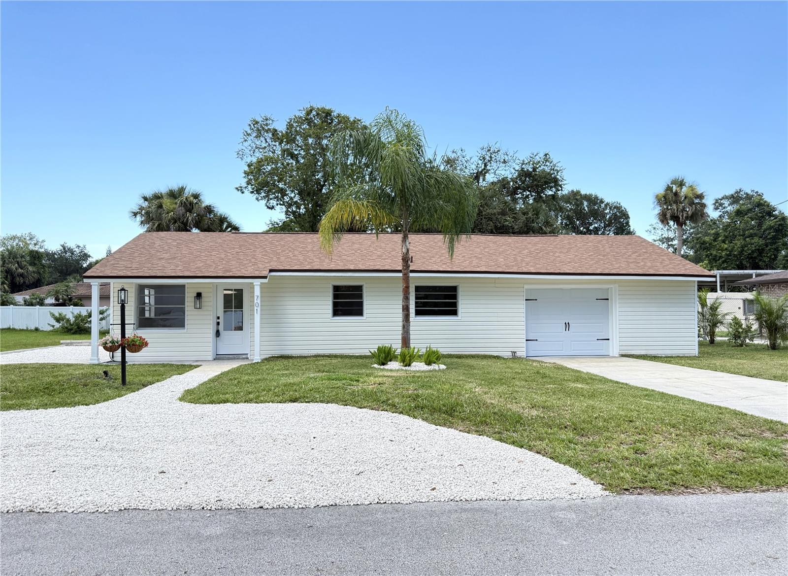 Renovated 3-bedroom, 1-bath home with a garage on .29 acres. Beautiful modern kitchen with white soft close cabinets, quartz countertops, and stainless steel appliances, including a dishwasher, side-by-side refrigerator, range oven, and built-in microwave. Built-in trash can drawer. The deep kitchen sink with a gooseneck faucet overlooks the pleasant landscaped front yard. Designer tile adorns the backsplash. In the bathroom, a modern light is built into the mirror above a raised sink, with a window for ventilation. All bedrooms feature louvered closet doors, and the center bedroom has exterior access door to the backyard. This is in a quiet neighborhood with a short drive to shopping and restaurants.