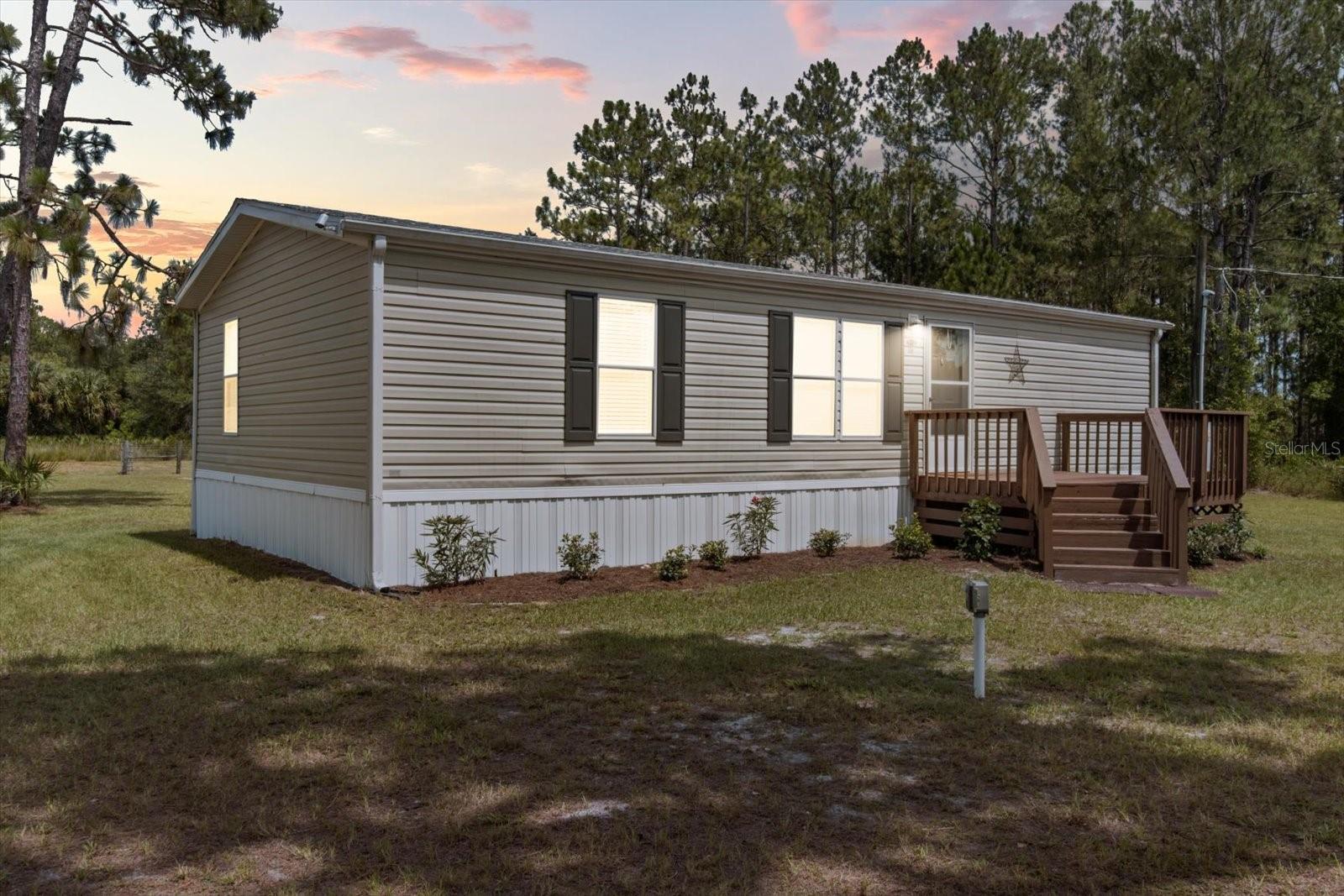 Discover peaceful country living just minutes from downtown Crystal River in this beautifully remodeled 3-bedroom, 2-bath home situated on just under 6 acres with NO HOA or Deed Restrictions! Nestled in a quiet, rural setting yet conveniently close to shopping, dining, and the Gulf Coast, this property offers the best of both worlds. Inside, you'll find a like-new interior with stylish updates and calming tones throughout. This home features all new flooring, drywall, trim, and molding, along with completely renovated bathrooms and a stunning kitchen with quartz countertops, new cabinetry, and stainless steel appliances. Additional updates include a new water heater (2025), new roof (2025), new skirting (2025), HVAC (2023) and attractive new landscaping for fantastic curb appeal. and modern fixtures throughout. Step outside and enjoy the fresh air from one of two large decks, perfect for entertaining or relaxing. The property is fully fenced with a gated entrance and is also cross-fenced, featuring a pasture area ready for your animals - ideal for hobby farming or simply enjoying the open space. Whether you're looking for a quiet retreat or a place to bring your furry friends, this turn-key home is a must-see. Schedule your private showing today!