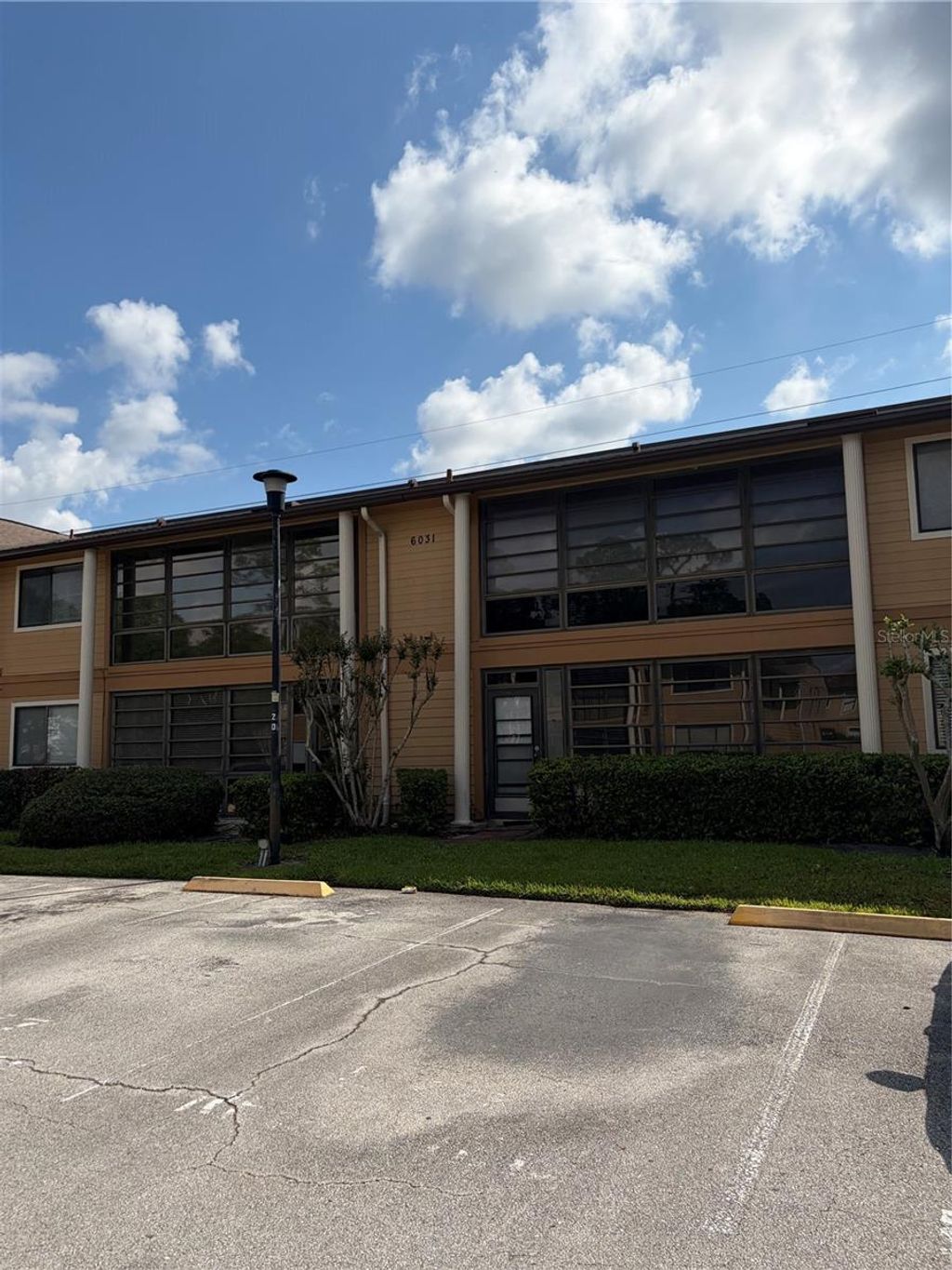 Photo of 6031 Scotchwood Glen #205, Orlando, FL 32822 (MLS # R4910965)