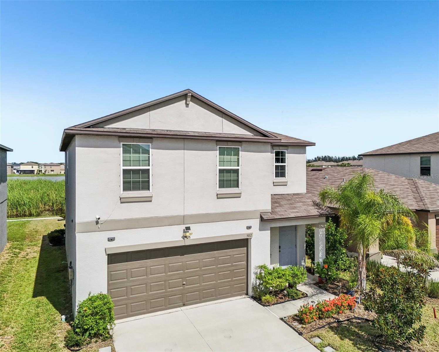 This beautiful 2022-built home offers a PICTURESQUE VIEW of nature just steps from your back patio! Located in the sought-after Glen Cove Community—where modern design meets everyday comfort—this 4-bedroom, 2.5-bath property features an OPEN-CONCEPT LAYOUT, a soft neutral palette, UPGRADED FLOORING including no carpet, and NO CDD FEES!
The stylish kitchen boasts a large island, soft-close pearl white cabinets, sleek GRANITE countertops, stainless steel appliances, and upgraded finishes—perfect for cooking and entertaining. Upstairs, a SPACIOUS LOFT provides flexible space for a playroom, office, game room, and more. The owner’s suite, which is tucked away opposite the other bedrooms overlooks the pond and conservation area, offering a private retreat with an en-suite bathroom, dual sinks, and walk-in shower. Three additional generously sized bedrooms share the second bathroom, all with upgraded flooring.
Step outside to a LARGE BACKYARD with tranquil views, a walkable trail to the community pool, and the potential to add fencing for extra privacy. Enjoy having low HOA fees and peace of mind knowing this is one of the more elevated properties in Ruskin—located in a NON FLOOD ZONE AREA!
Community amenities in Glencove include a community pool, clubhouse, and playground. Located in an idea location with shopping, dining, schools, and major highways just minutes away. Combining contemporary style with a prime location, this home is truly move-in ready.