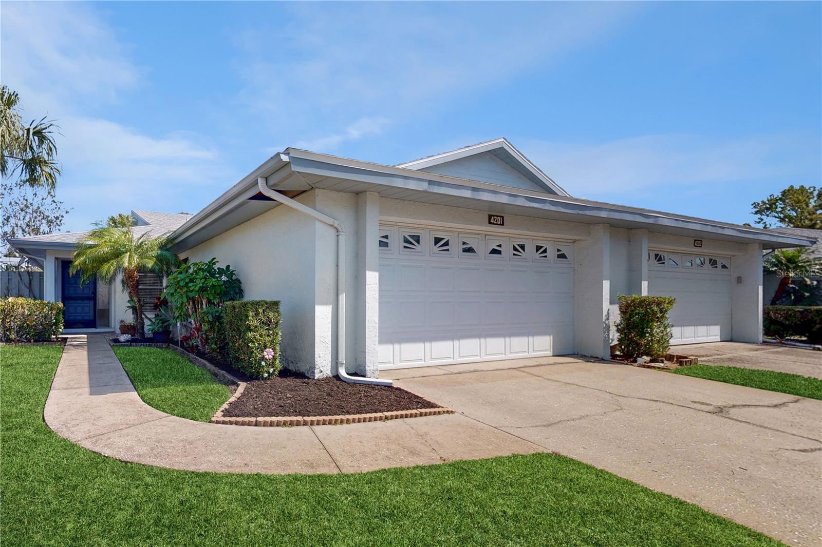 Welcome to this beautiful villa in the heart of the desirable Center Gate area! This 2 bed, 2 bath home on a generously sized corner lot, has been recently updated and includes new LVP flooring, updated kitchen cabinets & counters, NEW roof- Dec. 2023, fresh paint, and abundant natural light throughout. The seamless transition from room to room with the open concept floor plan is perfect for every day living! Upon entering the front door, you'll find the kitchen to your right with new white cabinets, quartz countertops, a corner eat-in nook, as well as a convenient pass through window to the dining area. Heading down the hallway from the entrance, you'll find the spacious combined dining room & living room, as well as a cozy outdoor terrace through the sliders to your left, perfect for gardening or an additional outdoor sitting area. On the other side of the home, you'll find the primary bedroom with en-suite situated at the back of the home and the second bedroom and hall bath up towards the front providing a ample separation between the two for added privacy. There is plentiful closet space throughout the home, a nice breezeway nook between the garage and kitchen, as well as a 2-car garage where you'll also find the washer & dryer. From the sliders in the living room or primary bedroom, you can access the covered/screened in lanai, perfect for early morning coffee, relaxing in the evenings, and taking advantage of the mature landscaping and natural surroundings. The association covers exterior maintenance, grounds maintenance, and basic cable TV. This location provides convenience with access to dining, shopping, medical facilities, main roadways, I-75, UTC, SRQ airport, and the gorgeous gulf coast beaches, as well as the community pool nearby. Don't miss out this fantastic opportunity in the beautiful community of Center Gate Village III. Schedule your showing today!!