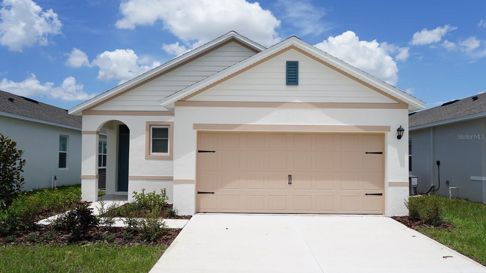 Under Construction. Avalon Park Tavares presents the Allex, available to build in Tavares, Florida. This all concrete block constructed, one-story layout optimizes living space with an open concept. As you enter the foyer you are greeted with a spacious dining room. Go down the hallway and enter a spacious kitchen featuring stainless steel appliances with ample counter space and a walk-in pantry for extra storage. The living room is complete with a view to the covered lanai outside. Bedroom one, located at the back of the home for privacy, has an en-suite bathroom that features a double vanity sink with a walk-in closet. Two additional guest bedrooms and one bath are tucked away down the hall from the Dining Room. The laundry room is located at the front of home near the two-car garage. Like all homes in Avalon Park Tavares, the Allex includes a Home is Connected smart home technology package which allows you to control your home with your smart device while near or away. *Photos are of similar model but not that of the exact house. Pictures, photographs, colors, features, and sizes are for illustration purposes only and will vary from the homes as built. Home and community information including pricing, included features, terms, availability, and amenities are subject to change and prior sale at any time without notice or obligation. Please note that no representations or warranties are made regarding school districts or school assignments; you should conduct your own investigation regarding current and future schools and school boundaries.*