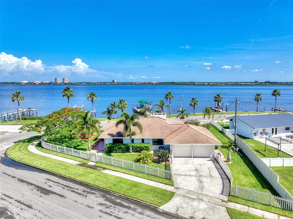 Price Improvement! A rare opportunity to own a stunning home on a corner lot in the highly desired historic community of Manatee Gardens. Experience a tranquil coastal lifestyle in this charming updated home. You will experience spectacular waterfront living and views along the Manatee River. Imagine the potential of your backyard by installing your own custom pool and lanai overlooking the water and enjoying the beautiful Florida sunset. The home features 3 bedrooms and 2 baths with an open floor plan which flows into the third bedroom/bonus room, all overlooking the picturesque water views. A great kitchen with a breakfast bar with granite countertops, white cabinetry, modern lighting and stainless appliances are great for casual family meals or entertaining. Brand new brick patio, fence around perimeter and garage door repaired, and all electrical brought up to code. The roof was replaced in 2007, windows in 2009 and HVAC in 2018. This is the place to bring your boat and all your water toys as this home has a state of the art dock, electric boat and jet ski lifts, S.S. hand rail with $5,000 locking gate, all completed May 2022. Right from your backyard, use the 17,000 pound lift to lower your boat directly into water to access the Manatee River with no deed or HOA restrictions. Direct access to the Intracoastal, Tampa Bay and the Gulf of Mexico. It doesn’t get better than that! Schedule your viewing today!