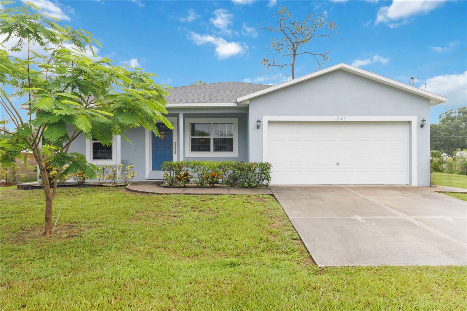 What a wonderful location for peace and quiet Florida living. Three bedrooms, two bath home built in 2004 with 1445 square feet. Attached garage, open floor plan, eat in kitchen and spacious master and master bath with separate tub and shower. Oversized lot with plenty of room to park your boat or RV. Just around the corner from the public boat ramp on Trout Lake. Walking distance from Lake Lizzie Conservation Area. Spacious front and rear covered porches so you can enjoy your mornings and evenings in comfort. Gazebo in the back yard for the barbecue just off the back porch. Multiple fruit trees on the property and mature landscaping. Roof 2020, 3-ton A/C 2020. Don't leave this one off your list