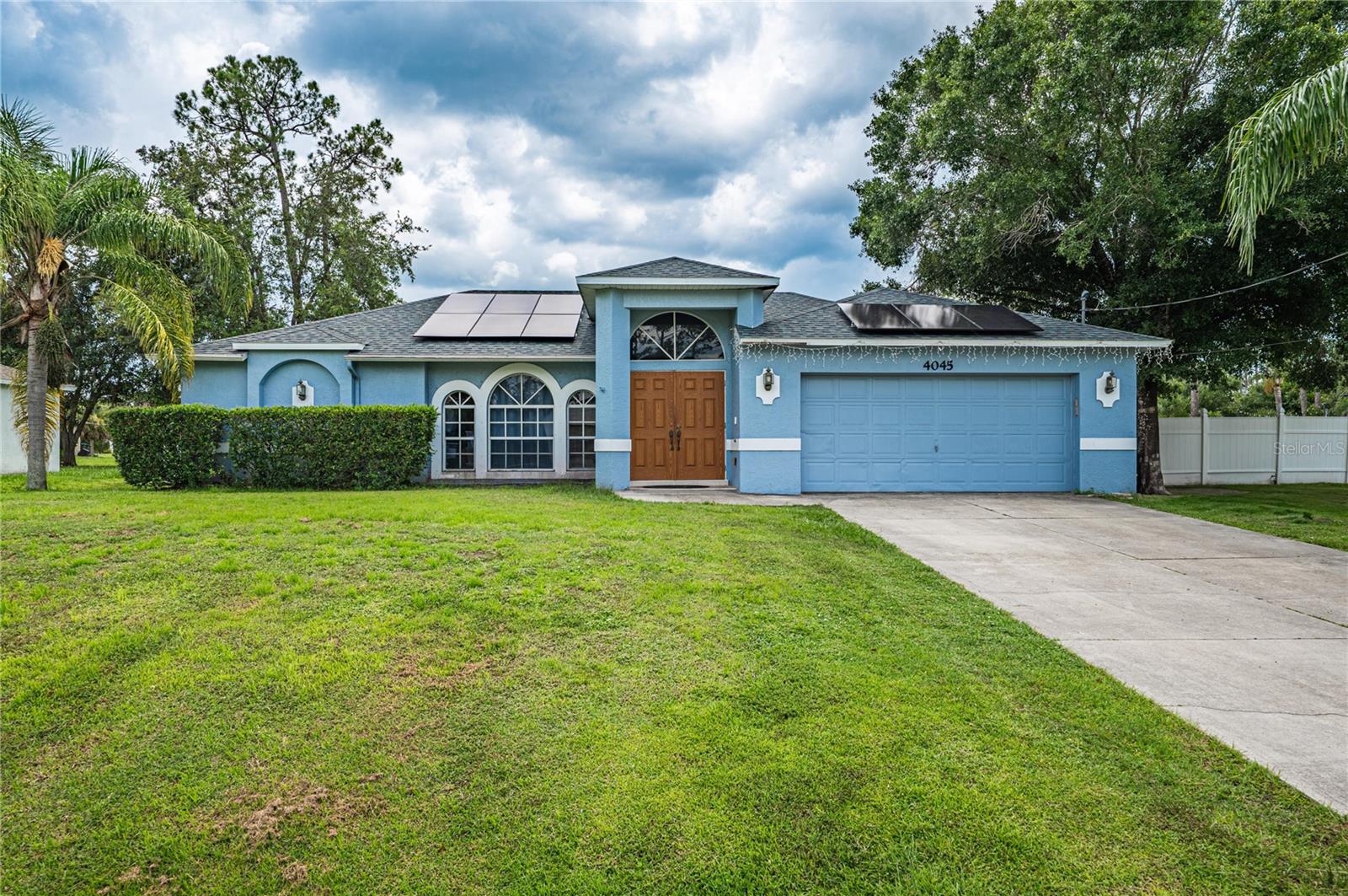 This beautifully maintained 3-bedroom, 2-bathroom pool home has the blend of comfort, style, and outdoor living. Located in a quiet North Port neighborhood this move-in ready home sits on a spacious lot with a beautiful pool and backyard—fully fenced and for relaxing or entertaining year-round.
Step inside to an open-concept layout with vaulted ceilings, tile flooring throughout, and tons of natural light. The kitchen features solid wood cabinetry, ample counter space, and a breakfast bar that opens to the main living area. The split floor plan has a private primary suite with a walk-in closet and en-suite bath, while two additional bedrooms share a full bath on the opposite side of the home.
Conveniently located near schools, parks, shopping, dining.