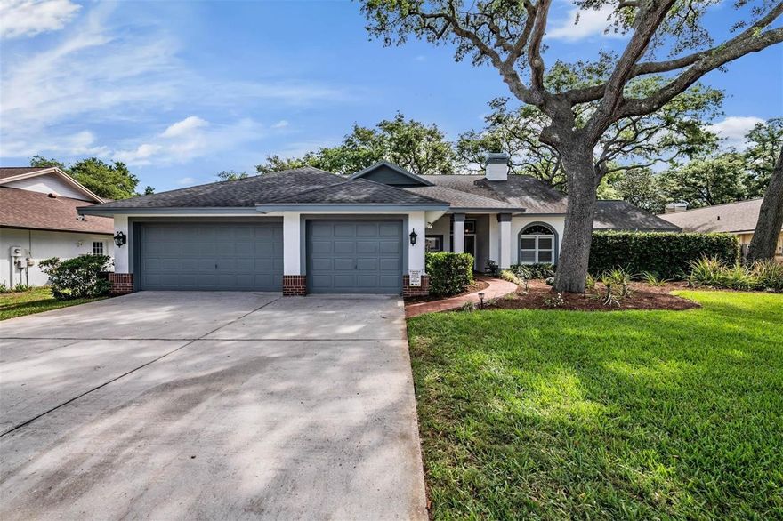 Welcome to the beautiful oak tree lined streets of Mason Oaks. Set on a sprawling .39-acre lot, this beautifully maintained 4 bedroom (plus a hidden office), 3 bathroom home with a 3 car garage offers exceptional curb appeal, lush landscaping, and a fully fenced backyard with a heated pool and spa. The exterior of the home is freshly painted (2026) The AC is new (2024) and the Roof is also newer (2020)! Step inside to soaring ceilings and a bright, open floor plan that creates an airy, inviting atmosphere. A formal living room greets you to the right, showcasing a stunning two sided fireplace shared with the spacious family room. To the left, a home office sits behind a hidden door that doubles as a storage shelf! The expansive kitchen is truly a chef’s dream, featuring granite countertops, custom cabinetry with abundant storage, stainless steel appliances, a center island with sink and breakfast bar, and even a built-in desk area. A cozy dinette sits just off the kitchen for everyday meals, while the adjacent family room opens seamlessly to the outdoors through a wall of sliding glass doors. Multiple sliders throughout the home, including in the kitchen, primary suite, and 4th bedroom, bring in natural light and provide direct access to the impressive outdoor living space. The primary suite is a private retreat, complete with two walk-in closets, pool access, and an ensuite bath featuring dual vanities, a soaking tub, and a walk-in shower. The split bedroom layout ensures privacy, with the 4th bedroom offering its own pool access and proximity to a full pool bath, ideal for a guest suite. Step outside to your own private oasis. The oversized screened lanai features a luxurious pool and spa (heat pump installed 2022), paver deck (new from 2026), plus an outdoor kitchen (2026). Beyond the lanai, an extended patio provides even more space for grilling and gathering. Conveniently located near shopping, dining, and major roadways, this South Valrico gem truly has it all. Schedule your private showing today!