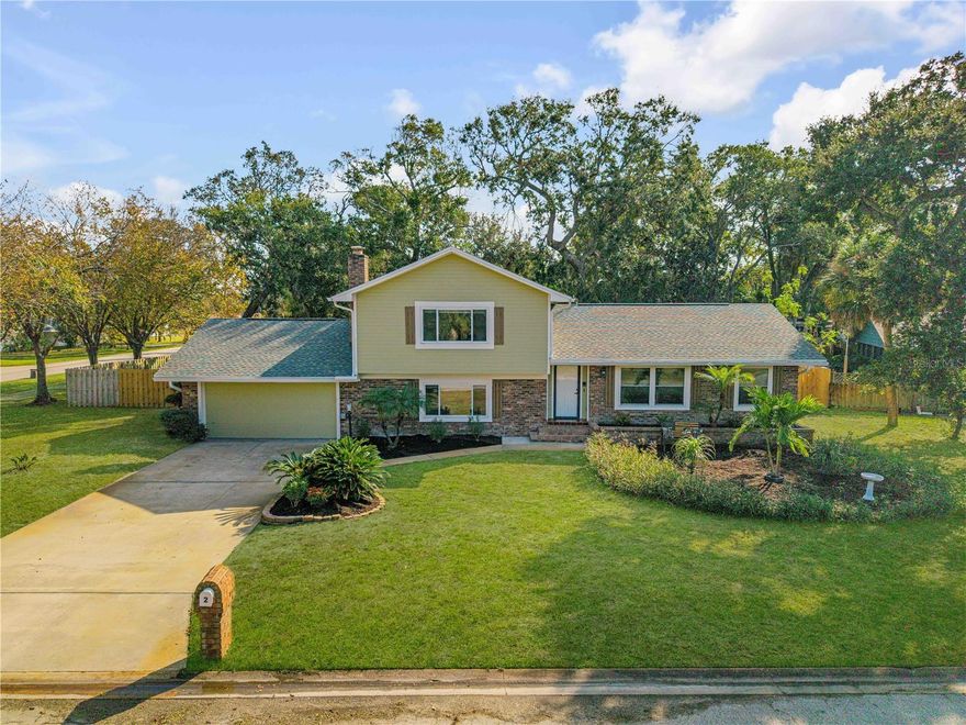 This fully updated tri-level POOL home offers an incredibly functional layout including 3 true bedroom suites, each with NEW full bathrooms, and sits in the desirable Oak Forest neighborhood of Ormond Beach. Set on an oversized, fully fenced corner lot with a peaceful park-like feel equipped with an RV plugin, this home has it all with space, comfort, and outdoor living. Finishing off the highlights are the major updates you want to see: a brand NEW HVAC (2024) and a newer 30-year architectural shingle roof installed in 2020. Inside, the upgrades stand out immediately. The kitchen features NEW high-end espresso wood cabinetry paired with NEW premium Calacatta quartz countertops, stainless steel appliances, and a casual breakfast nook overlooking the pool area. NEW luxury vinyl plank flooring flows throughout the home, complemented by the original hardwood parquet staircase leading to the upper-level suites. Most windows have been replaced with large bay-style double-pane windows, allowing abundant natural light in every room. NEW interior paint throughout gives a fresh, clean feel. The home also features NEW light fixtures, NEW baseboards, and NEW plumbing fixtures for an elevated, modern finish. The tri-level design balances togetherness and privacy. The main level features the upgraded kitchen, living and dining area, and a spacious laundry room. Two steps down leads to the lower level, which includes a full guest suite and a cozy family room centered around a classic brick wood-burning fireplace. Upstairs you will find two private bedroom suites, both with walk-in closets. Outdoor living shines here. The screened-in pool and jetted spa have a NEW painted pool deck and sit just off the main kitchen area, with a large 16 x 14 covered patio ideal for outdoor dining or a future summer kitchen. The oversized fenced yard provides excellent privacy, plenty of room to play, and ample space to park your boat and RV camper! The yard is also equipped with an irrigation sprinkler system. Additional highlights include an oversized 2-car garage with generous dual attic access on each end of the home to store all your holiday decorations! Oak Forest is known for its tree-lined streets, convenient access to Tomoka State Park, and proximity to some of the best school zones in Ormond. This home has been thoughtfully updated and well cared for, offering a comfortable lifestyle both indoors and outdoors.