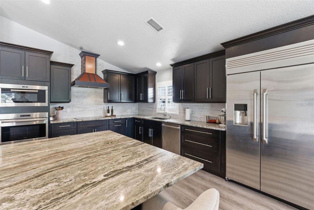 Photo of 23450 Cherbourg Loop, Land O Lakes, FL 34639 (MLS # TB8505026)
