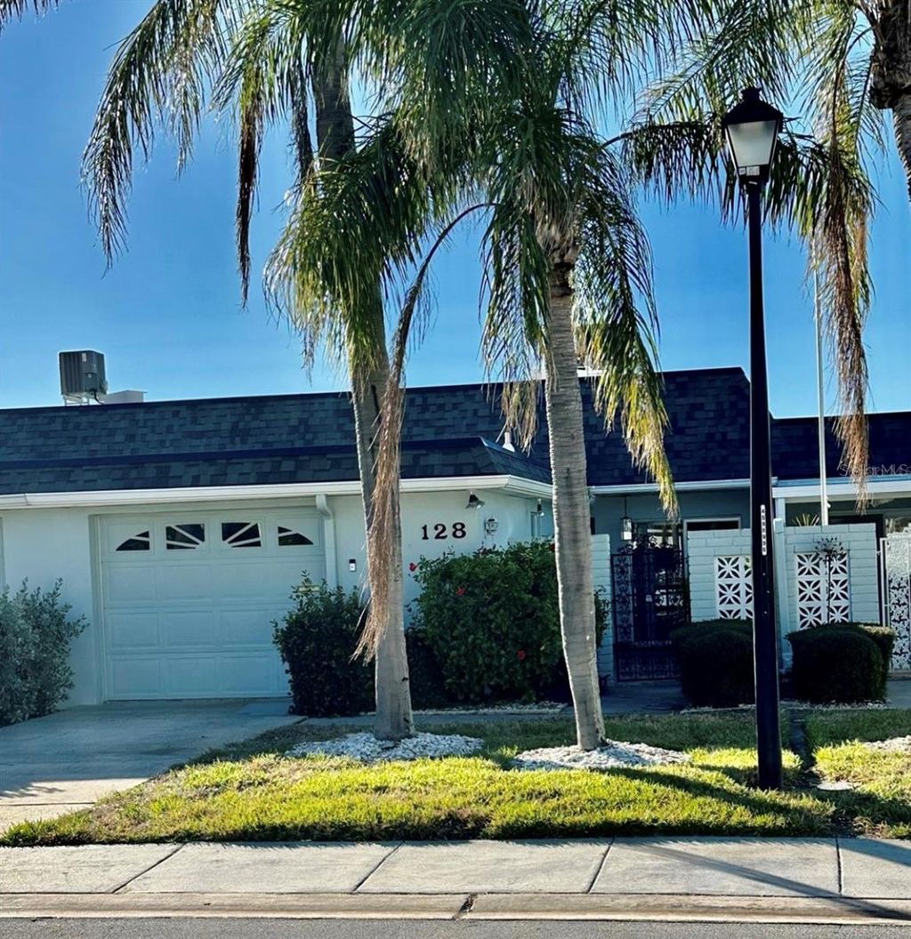 Photo of 128 Boca Ciega Point Boulevard N, St Petersburg, FL 33708 (MLS # TB8466956)