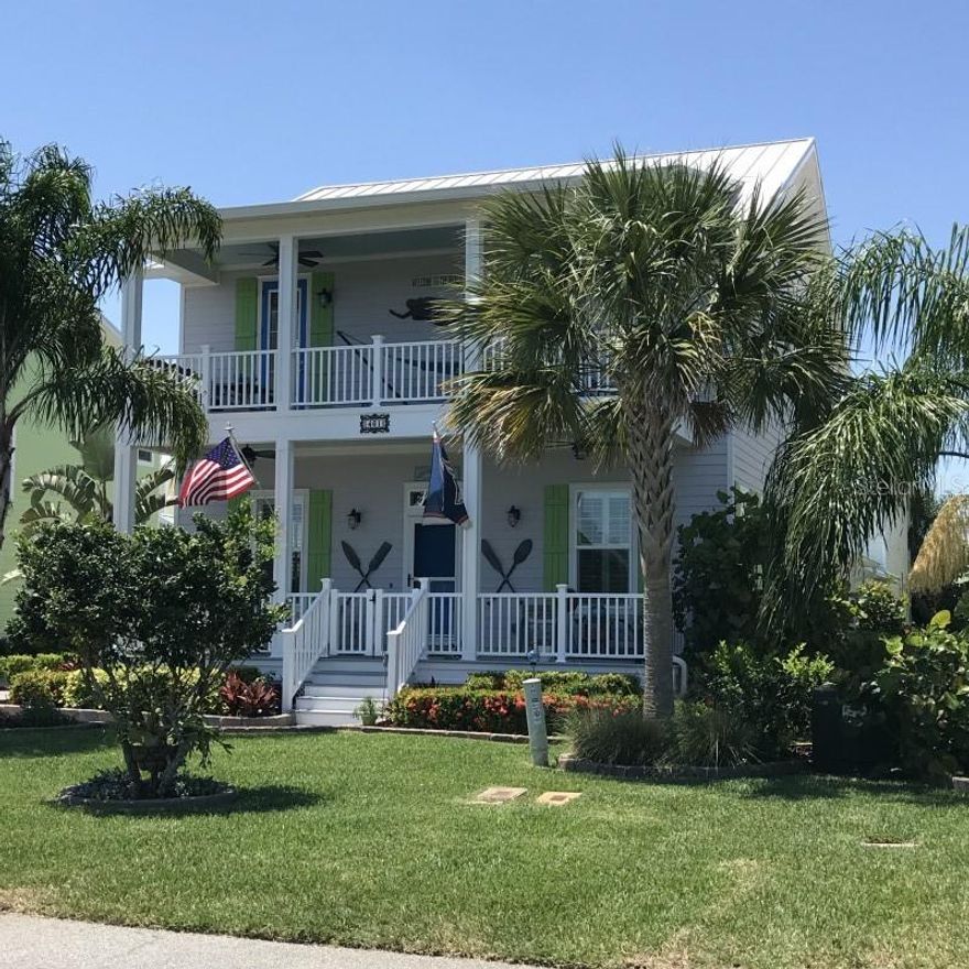 Key West style 2 story home with porches on each level on the North Causeway. Fantastic view of the intracoastal waterway and a location within walking distance of the two main shopping and dining districts of New Smyrna Beach. Must be seen to appreciate the quality of the construction and design. Details of this home include: 24 gauge stainless steel roof, 10' ceilings, granite countertops in all wet areas, bead board porch ceilings painted blue with TREX porch decking, 8' doors, crown molding in all living areas, epoxy coated garage floor, full lush landscaping, and brick paver driveway and edgings. 2-car side entry garage at back of house, outdoor shower. Highly sought after neighborhood of Cottages At Flagler by Walters Construction. ;Water: City