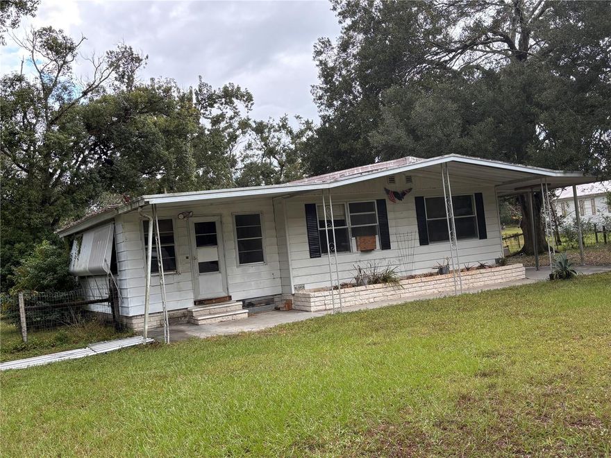 Great property - 1.25Acre parcel with 1976 DWMH and 2 car garage. Mobile in need of repair.  Terrific location, paved road and so many possibilities.  Hurry won't last long.