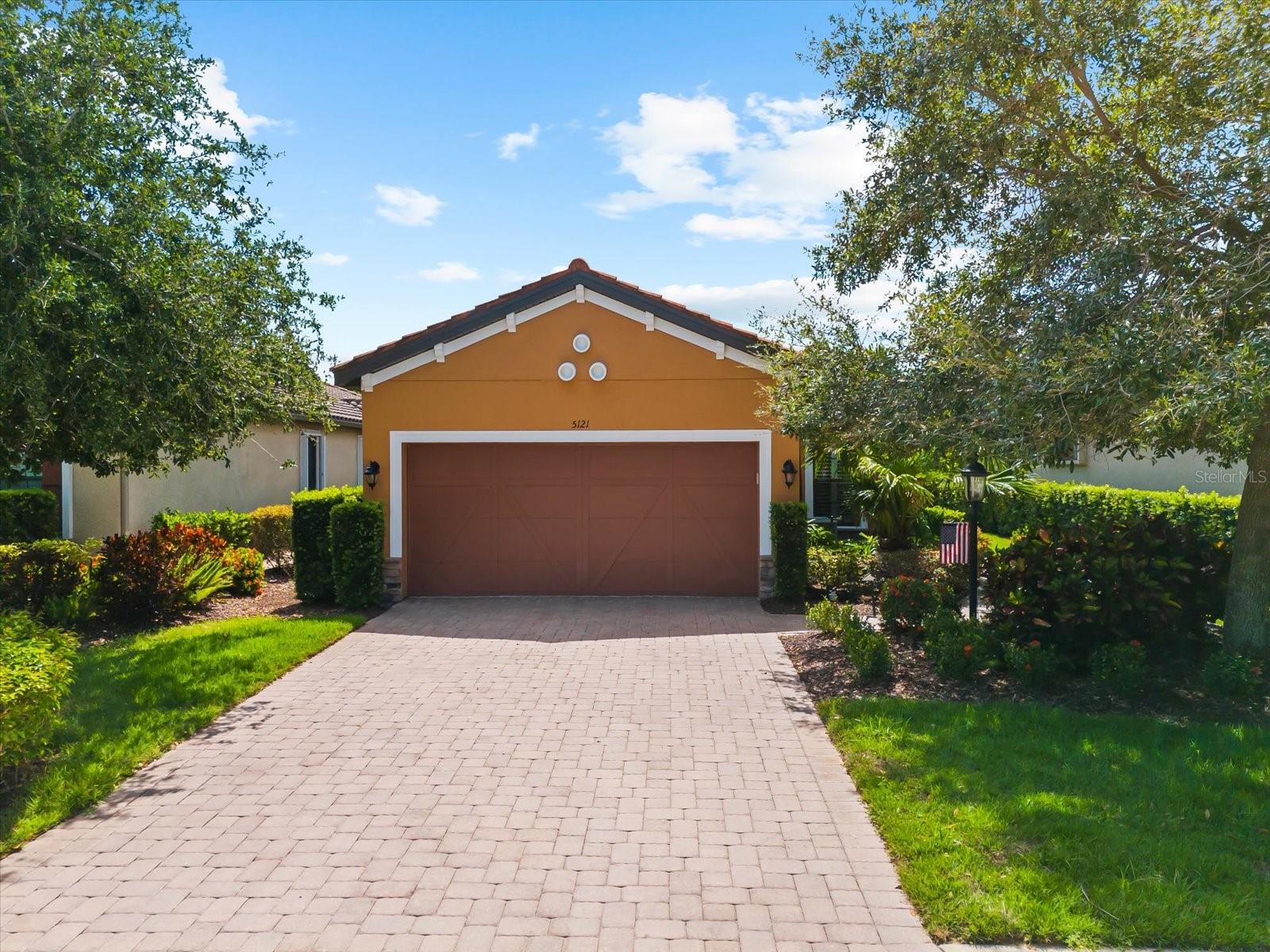 Resort-style living awaits in Esplanade Golf and Country Club of Lakewood Ranch! Welcome to effortless, maintenance-free living in one of the area’s most sought-after communities. Nestled on a private lot, this meticulously maintained Roma floor plan offers comfort, function, and style in equal measure. Designed with everyday living and entertaining in mind, the open-concept layout features 2 generously sized bedrooms, 2 full bathrooms, and a versatile office or den. The split-bedroom floor plan provides ideal privacy for guests while maintaining a natural flow throughout the home. At the heart of the home, the chef’s kitchen shines with 42" cabinets, crown molding, granite countertops, a tile backsplash, gas stove, stainless steel appliances, and a layout perfect for hosting. The kitchen seamlessly connects to the spacious great room and extends out to the private, oversized lanai—ideal for dining al fresco, relaxing with a good book, or entertaining family and friends. Unwind in the serene owner’s suite, complete with an oversized walk-in closet and a spa-like bath featuring dual sinks, a dedicated vanity, and a spacious shower. Upgrades to this home include crown molding, plantation shutters, luxury vinyl flooring (2025), fresh exterior paint (2025), a new refrigerator, and a new dryer—offering peace of mind and turnkey convenience. Living in Esplanade is like being on vacation every day. Enjoy world-class amenities including a resort-style zero-entry pool, resistance pool, state-of-the-art wellness and fitness center, and a vibrant 12,000 sq. ft. clubhouse. Sports enthusiasts will love access to pickleball, tennis, bocce, and kayaking. Golfers can enjoy the challenging 18-hole course with pay-to-play access. The lifestyle here is as social as it is relaxing, with a full-time lifestyle director coordinating clubs, events, and community gatherings. Treat yourself at the on-site salon and spa or indulge in the dining options at The Barrel House Bistro, the poolside Bahama Bar & Café, or attend cooking classes at the Culinary Center. Located within one of Lakewood Ranch’s most desirable master-planned communities, this home is close to top-rated schools and just minutes from UTC shopping and dining, SRQ Airport, downtown Sarasota, and the stunning Gulf Coast beaches. This home is more than just a place to live—it's a lifestyle you'll never want to leave.
