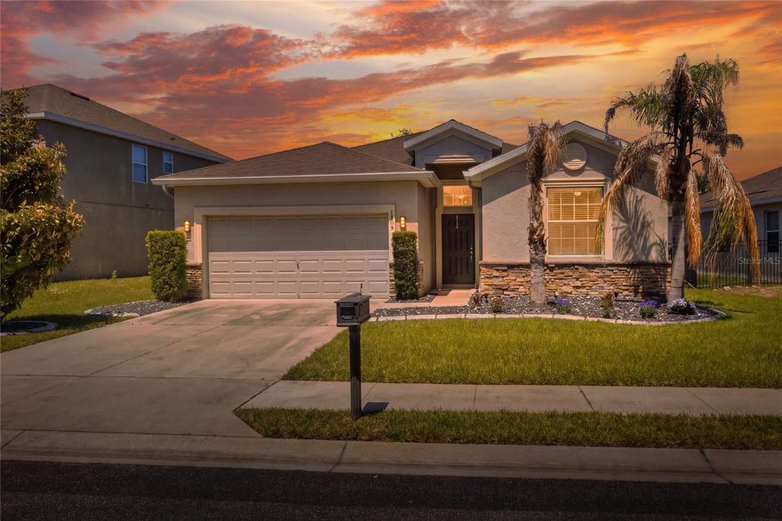 Come and See  this beautifully designed contemporary home, sitting in a quiet Resort Community in Central Florida. Offering both Comfort and Convenience, this home is just a short drive from world-famous theme parks such as Disney World, Universal, and LegoLand, and only about 1.5 hours from the stunning beaches on either side of the State. As you step onto the front porch and then enter through the front door, you're greated by a wide long Hallway with attractive large tile that goes throughout most of the home. To the right, there's a short hallway going to 2 nice size bedrooms (one is currently being used for an office) and a nice bathroom between them with granite counter tops and a Tub/Shower. As you contuniue down the Hall you'll enter the Hugh Great Room that includes the Dining Room area, the entertaining / relaxing place, that also leads out to the Lanai that over looks the back yard area, and to the left is the Gourmet Kitchen with a 16 foot opening with an island ideal to see the home's chef preparing a wonderful meal. With the beautiful Kitchen Cabinets, Stainless Steel Appliances, granite counters, attractive Tile backsplash, and a walk in pantry loaded with delightful food, this will be on your list of your "HAPPY PLACES". Just past the Kitchen of the Great Room is the door entering into the Large Master Ensuite. The beautiful different tile floors will catch you eye as you enter and you will know that this is a great place to begin and end your busy days. When you head into the Master Bathroom area, you will be impressed with the two large closets on each side of you, one with a hugh floor to ceiling shoe rack. The Master Bathroom has everything you would hope for, a separate soaking tub, and a walk in Shower, duel Sinks set in granite counter tops, a water closet, and the same other beautiful tile that goes throughout this Awesome Home. Also included to be mentioned is a nice size indoor Laundry Room on the way out to the 2 car Garage. The home has 5 smoke detectors, an irrigation system, and more. OH... lets not forget to mention the Community has a Golf Course, Swimming pools, tennis courts, pickel ball counts. and much more to keep you from needing to leave the community. Come and see this AWESOME HOME that is PRICED TO SELL.