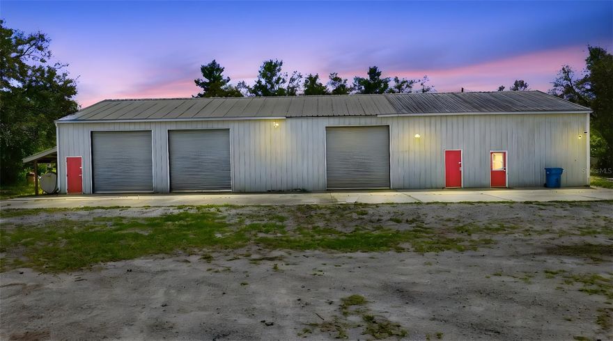 PRIVATE 9.86-ACRE COUNTRY RETREAT WITH MASSIVE STEEL BUILDING + LIVING QUARTERS!
Bring your horses, cows, RV, and all your toys—this nearly 10-acre, fully fenced and cross-fenced property offers the space, privacy, and flexibility you’ve been looking for!
The centerpiece is an impressive 40x100 insulated steel building featuring (3) 12-ft roll-up doors and a 13-ft sliding door, plus a 6" concrete floor—perfect for equipment, hobbies, or a workshop. Above, a HUGE loft provides exceptional storage, and out front you’ll find a massive 100x20 concrete pad ideal for additional parking or workspace.
Live comfortably while you build your dream home! The property includes a move-in ready apartment with full kitchen, bathroom, and washer/dryer—perfect for immediate use or guest quarters.
Additional features include:Solar-powered electric gate for secure entry; Private well (no water bill!); Two large fuel tanks for farm equipment; Metal carport—perfect for a boat or RV; Detached 20x12 storage building; Shelving in main building INCLUDED!
Enjoy the peace and beauty of this secluded, tree-filled property with gorgeous magnolias and room to roam.
BONUS: Ranger/Polaris conveys with purchase—explore your land in style!
Prime DeLand location on Marsh Rd:

    Just 20 minutes to Daytona Beach;
    Only 10 minutes to I-4 for easy access to Sanford & Orlando. 

This is a rare opportunity to own a versatile, ready-to-use property with endless potential—farm, homestead, business, or build your dream estate!