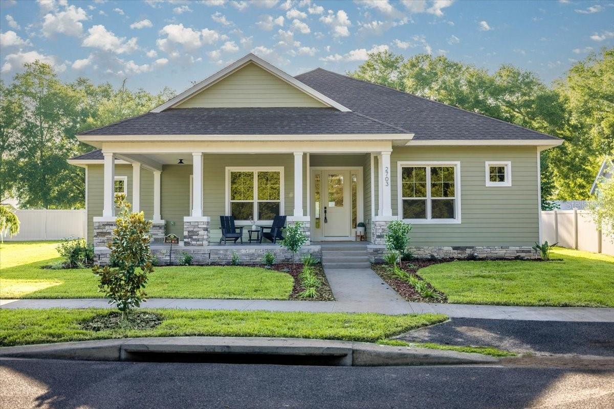 Charming Craftsman-Style Home in The Park – A Unique Community in The Magnolias of Ocala! Welcome to this beautifully designed 3-bedroom, 2.5-bath custom home with a flex room in The Park, a private, gated community nestled within The Magnolias of Southeast Ocala. One of its most inviting features welcomes you right away—a charming wrap-around front porch that sets the tone for the warmth and character found throughout this home. Step inside to an open-concept layout filled with natural light, 10-foot ceilings, and striking 11-foot tray ceilings in the grand room and primary suite. Rich architectural details such as 8-foot doors, 5.25 inch baseboards, and 7-inch crown moldings reflect the home’s Modern Craftsman design and elevate every space. The cozy flex room, just off the main living area, provides the ideal space for a home office, playroom, or reading nook—easily adaptable to suit your lifestyle.
The heart of the home is the gourmet kitchen, outfitted with KitchenAid appliances, custom cabinetry, a pot filler, distinctive granite countertops, and a sunlit walk-in pantry. Stackable four-panel sliding doors open fully to a spacious covered lanai, creating a seamless transition between indoor and outdoor living—perfect for entertaining or relaxing with morning coffee. The primary suite is a true retreat, featuring his-and-hers walk-in closets and a luxurious spa-like bath with a separate stand-alone tub, walk-in shower, and elegant finishes. Both guest bedrooms also include their own walk-in closets, offering comfort and ample storage. The functional laundry room includes built-in cabinetry, a utility sink, and a convenient storage closet—designed for maximum organization and ease.
The extended two-car garage features an oversized 18-foot wide by 8-foot high door—ideal for large vehicles or additional storage needs.
As a resident of The Park, you'll enjoy access to exclusive gated amenities, including a private playground, pickleball court, and a covered pavilion perfect for celebrations and neighborhood gatherings. Ideally located just minutes from schools, medical centers, shopping, and Ocala’s vibrant downtown, this home offers the perfect blend of comfort, craftsmanship, and community.
Come fall in love with this exceptional home in The Park—schedule your private showing today!