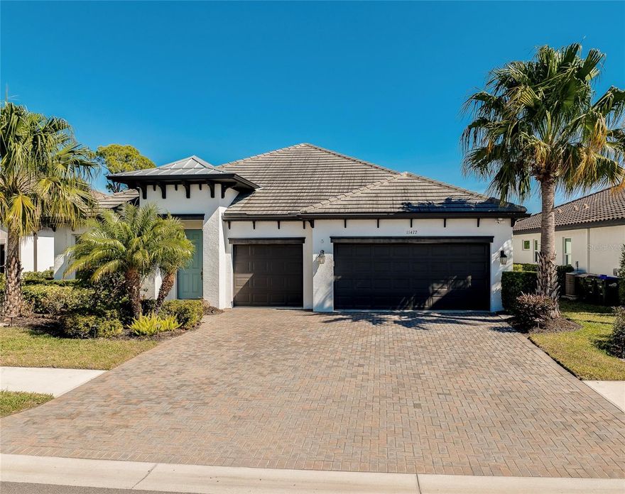 Welcome to your private slice of paradise in the gated community of Oasis at Wellen Park. This home is now being offered FULLY FURNISHED, adding unparalleled ease and convenience for potential buyers—simply move in and start enjoying this beautiful town in sunny Florida from day one. This move-in ready 4-bedroom, 3-bath, 3-car garage home showcases over $100,000 in upgrades and is perfectly positioned on a premium lake and preserve lot with exceptional privacy and one of the most desirable views in the community. Built by M/I Homes with a transferable structural warranty and no hurricane damage, this residence delivers both quality construction and peace of mind. Inside, the open-concept great room features soaring ceilings, porcelain tile flooring, Hunter Douglas plantation shutters, and expansive sliding glass doors that showcase the view while seamlessly connecting indoor and outdoor living. The gourmet kitchen is designed to impress with a large island, quartz countertops, GE stainless steel appliances, 5-burner cooktop, and double convection ovens. Step outside to your private outdoor living space featuring a custom saltwater pool, infinity-edge spa, waterfall, sun shelf, and travertine deck, all set against a peaceful preserve backdrop. The oversized lanai with landscape lighting creates the ideal setting for relaxing or hosting. The owner’s suite is a true retreat with serene water views, a spacious walk-in closet with custom built-ins, and a private coffee bar morning station. The spa-like bath features dual vanities and a large walk-in shower. Additional highlights include a whole-house water softener plus reverse osmosis system, full surge protection, and a Ring security system. Ideally situated for maximum convenience, this home is located in close proximity to the front gate for smooth entering and exiting, as well as the community mailboxes for easy daily access. Enjoy maintenance-free living with access to a clubhouse, community pool, pickleball courts, and scenic walking paths—just minutes from Downtown Wellen Park, CoolToday Park, and Manasota Key Beach. Turnkey, upgraded, and FULLY FURNISHED—this home is ready for you to enjoy from day one.