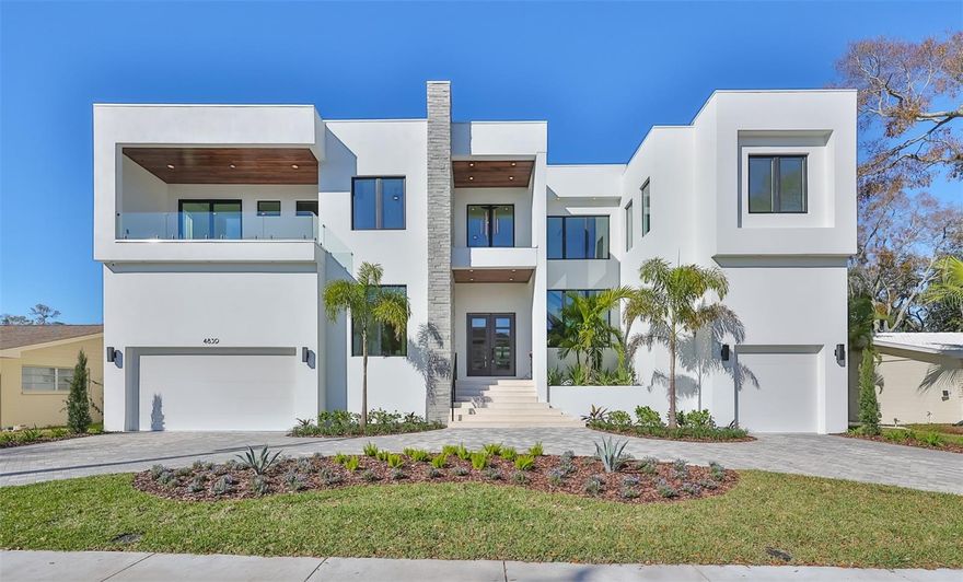 New Construction - Welcome to this exquisite luxury home by Livistona Homes that exudes elegance, sophistication, and unparalleled comfort. Situated in the prestigious neighborhood of Sunset Park, the modern design boasts six bedrooms, six and a half baths, and an array of exceptional amenities that redefine luxurious living. As you step inside, you are immediately greeted by a two-story entry with soaring 24' ceilings, impressive glass railings, an open dining room, and an abundance of natural light. The Butler's pantry connects the dining room to the well-appointed Kitchen equipped for a chef, including custom cabinetry, a waterfall quartz island, built-in paneled Subzero refrigerator, Wolf Cooktop, a Wolf double oven, two Bosch dishwashers, a drop ceiling with LED lighting and a glass wine display.  The spectacular great room features a stunning 12' gas fireplace with a wood accent and sleek stone finish as well as retractable sliding glass doors open to the outdoor entertaining space. An executive office, mudroom, first-floor laundry, and guest bedroom with ensuite bath complete the remainder of the first floor. The second level offers a decadent oversized primary suite with a sitting area, walkout balcony, custom walk-in closet with island and an impressive ensuite bath including a soaking tub. The thoughtfully designed second-floor plan is finished with four additional bedrooms, two of which share a private balcony, three full baths, second-floor laundry that also connects to the primary closet, and a Media room with a wet bar and balcony walkout. The final showstopper on this impeccable home is the luxurious backyard retreat. Perfect for entertaining or spending days outdoors; this tropical oasis features a saltwater pool with a cascading waterfall and spa, as well as an oversized lanai space with an outdoor kitchen, outdoor fireplace, and separate pool bath. Additional appointments to this meticulous design are impact windows and doors throughout, surround sound speakers, security and surveillance cameras, two-story block construction, custom closet systems, a circular drive, 3 car garage with epoxy flooring, and an elevator shaft. Less than 10 minutes to Tampa International Airport, shopping, waterfront restaurants, major highways, and downtown with the Riverwalk and Water Street, this location allows you to enjoy all the pleasures and luxuries of living in Tampa and the Florida lifestyle.