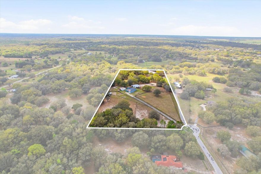 Luxury Farm Living with Modern Upgrades – No HOA! Welcome to this beautifully upgraded private farm retreat tucked away at the end of a cul-de-sac in Dunnellon. Designed for both comfort and functionality, this property offers the perfect blend of modern technology, energy efficiency, and equestrian amenities on fully fenced acreage with open pastures and majestic shade oaks. The home features cathedral ceilings, new windows throughout (2018), updated A/C (2021), and a new roof (2021) for peace of mind. Stay connected with Spectrum fiber optic internet, Spectrum TV service, Starlink installation, and a cell phone/WiFi booster. Additional upgrades include solar panels (2025), wired generator plug-in, ADT security system, fire and smoke detectors, and a Whirlpool water softener system (2018). Enjoy year-round Florida living in the huge Florida Room with mini-split (2024) overlooking the stunning heated saltwater pool and spa with waterfall and screened enclosure installed in 2023—perfect for entertaining or relaxing in privacy. Equestrian enthusiasts will love the concrete block stucco 3-stall barn with room for additional stalls, wash/grooming rack, and office or tack room. The property is completely fenced with 10 paddocks, open pastures, and large shade oaks, creating an ideal setup for horses or livestock. Additional features include two storage sheds, several awnings, remote gate entry system, and ample space for equipment. With ceiling fans, light fixtures, and window blinds all conveying, this property is move-in ready and thoughtfully designed for country living with modern convenience. No HOA — bring your horses, toys, and enjoy the freedom of farm life just minutes from medical, shopping, dining, The World Equestrian Center and the beautiful Rainbow Springs State Park! Schedule your showing today! Buyer and buyer's agent to verify all information.