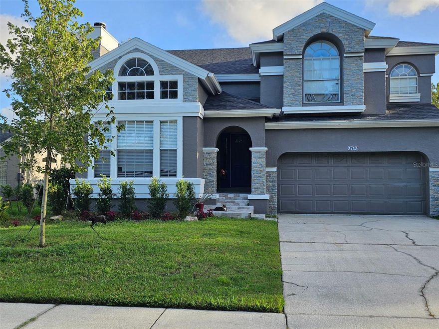 Welcome to your fully reimagined dream home in the highly sought-after Isles of Little Creek where every inch has been beautifully Totally  Renovated inside and out. From the moment you arrive, you’ll notice the stunning curb appeal with fresh exterior paint, elegant stone accents, and a newly planted Red Maple. Inside, soaring vaulted ceilings, abundant natural light, and brand-new tile and vinyl flooring create a bright, modern feel throughout. The home also features new interior paint, updated lighting, and smooth ceilings replacing outdated popcorn. The heart of the home is the upgraded kitchen, showcasing 42” cabinets, Quartz countertops, tile backsplash, and newer stainless steel appliances, along with a cozy eat-in nook. The layout flows seamlessly into the living room with a built-in entertainment center, while the formal dining and family room with a stone-accented wood-burning fireplace provide perfect spaces for entertaining.
Step outside to your private backyard oasis featuring a heated salt water pool and spa with a stunning rock waterfall and a new saltwater system and lighting. Enjoy peaceful, private views with frequent visits from deer and birds your own slice of paradise. Upstairs, the spacious primary suite offers a fully renovated bathroom with dual glass bowl vanities, a Jacuzzi tub, frameless glass shower, and custom tile work. Two oversized guest bedrooms and an updated guest bath complete the second floor. Major upgrades include a new roof, all-new plumbing, solar panels, new A/C, and a new water heater providing comfort and efficiency and peace of mind for years to come. The garage has been converted into an entertainment room,, perfect for creatives or easily adaptable to your needs, and easily converted back to garage.  Located in a desirable community featuring a beautiful fishing pond with a dock, this move-in-ready home truly has it all. One look and you’ll know this one is special. Within a 1 mile of Carillon Elementary, Hagerty Highschool, and Seminole state College.