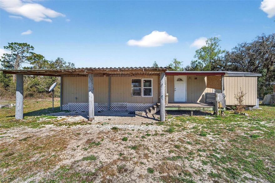 Welcome to 35238 Manuel Street in Webster, Florida—where you get both space and a place to call home. Situated on 5 fully fenced acres, this property features a 3-bedroom, 2-bath double-wide manufactured home (1991) offering 1,150 square feet of living space.

Interior features include wood flooring, solid wood cabinetry, central air conditioning, a metal roof, and a covered front porch perfect for enjoying peaceful country views. Storage sheds and additional structures provide extra functionality for equipment, tools, or hobbies.

The land itself spans approximately 656 x 332 with 656 feet of frontage and is zoned Residential in Flood Zone X. Utilities include well water, septic, electricity, and high-speed internet availability.

No HOA. No CDD. AG exemption eligible. Located in Hernando County with convenient access to nearby towns while maintaining privacy and room to spread out.

Ideal for those seeking rural living, a homestead setup, or a property with immediate livability and long-term land value.

Survey available. Property being sold As-Is. Schedule your showing today.