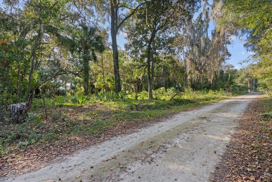 Just minutes from Gainesville, Hawthorne, and the scenic shores of Newnans Lake, this 1.18-acre parcel offers the ideal location for your future home. Enjoy nearby access to a public park and a peaceful, nature-filled setting with a convenient commute to town. The lot sits high and dry, is partially cleared, and comes with a current survey, making it ready for your custom build. With no HOA restrictions, you have the flexibility to design your space exactly as you envision.