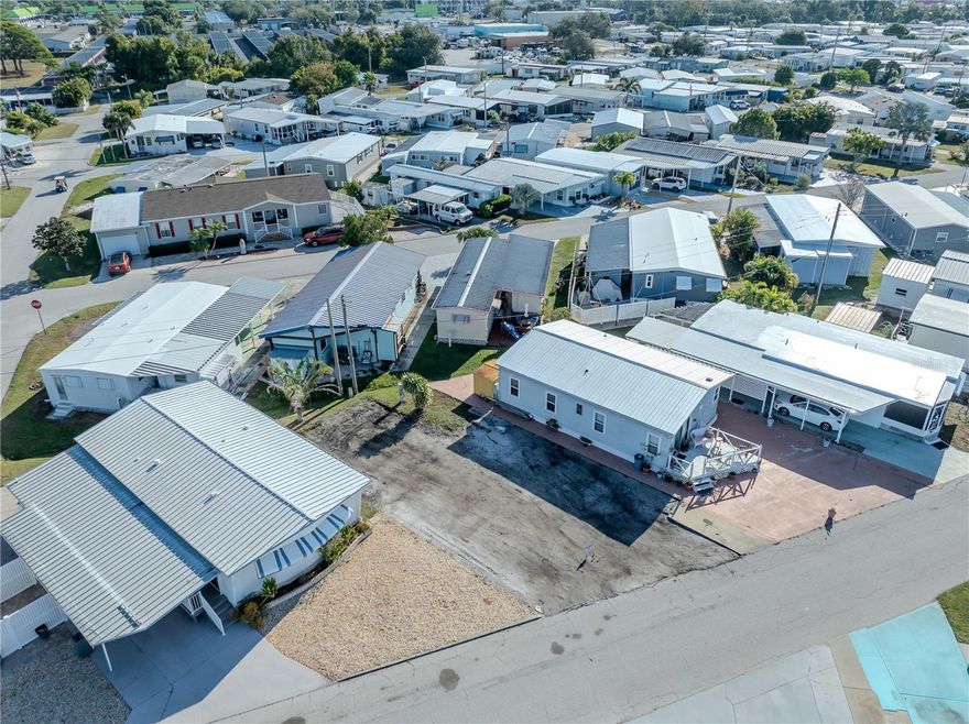 Generous opportunity to create your ideal home in a welcoming mobile home community.  You own the land!  No lot rent. This vacant lot is ready for the installation of a brand-new manufactured home, offering a blank canvas for your vision.  Surrounded by vibrant neighbors and a friendly atmosphere, this location combines affordability with a sense of connection.  Whether you're looking to settle into a full-time Florida lifestyle or a seasonal retreat, this property has the flexibility and potential to make it happen.  Trailer Estates many amenities including community pool, private marina, its own post office, shuffle board, community center with many group activities and golf cart friendly.  Easy access to the Sarasota/Bradenton Airport, nearby beaches, shopping and restaurants.  Don't miss your chance to be apart of this low-maintenance lifestyle with all the perks of community living.