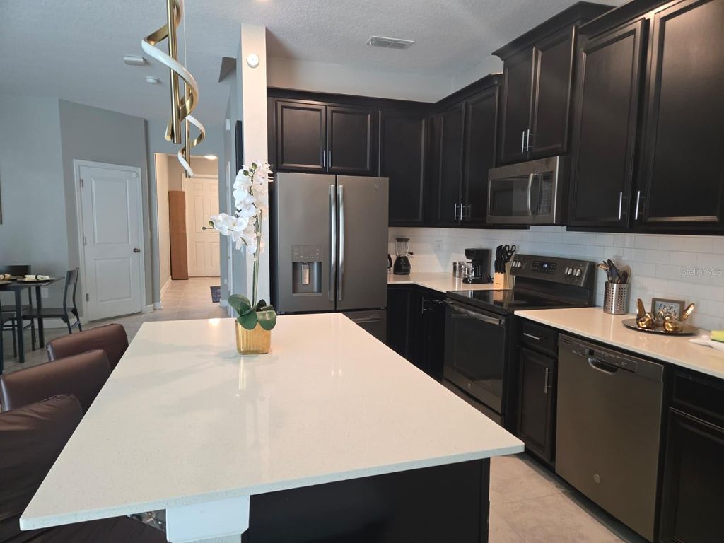 Photo of 4806 Tribute Trail, Kissimmee, FL 34746 (MLS # O6363096)