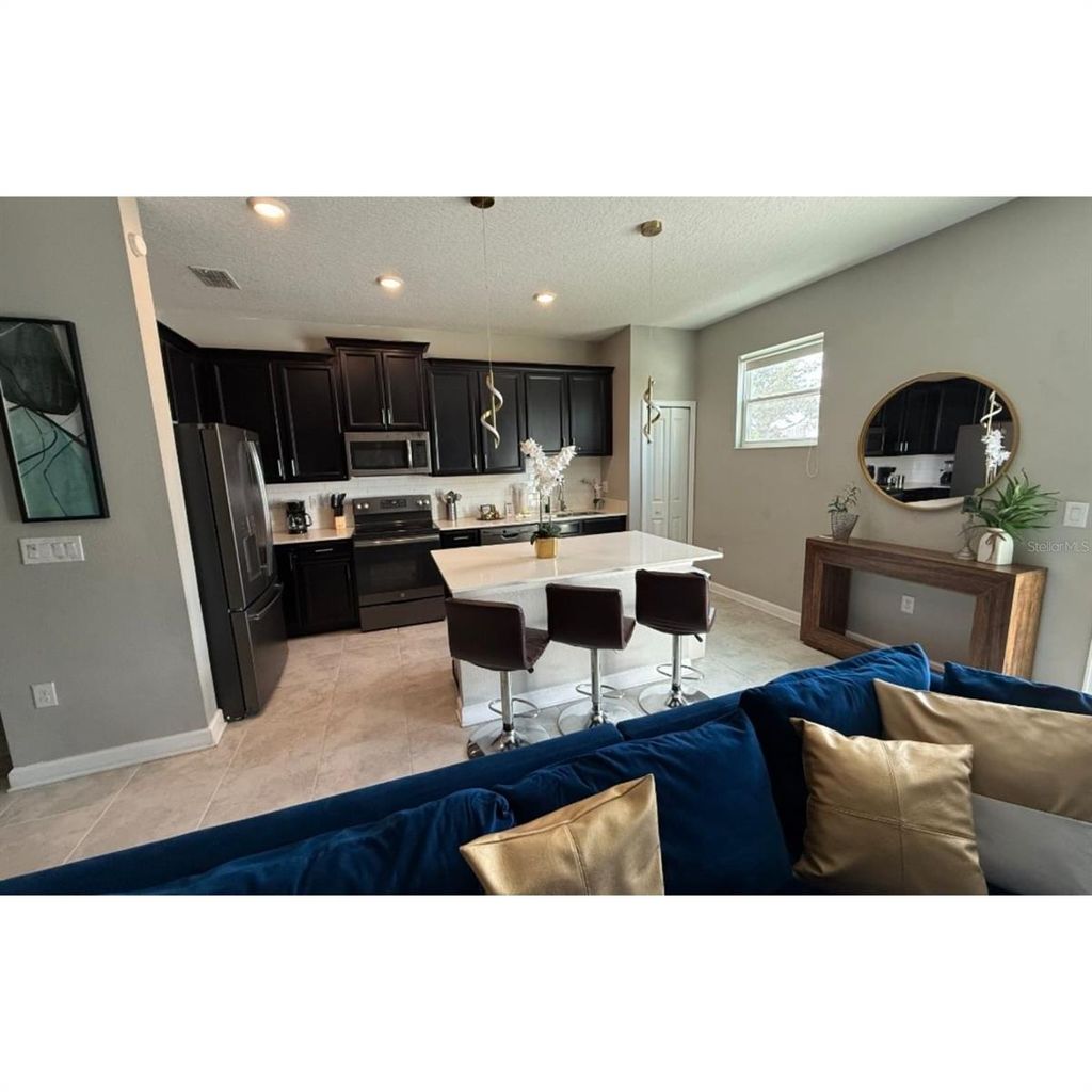 Photo of 4806 Tribute Trail, Kissimmee, FL 34746 (MLS # O6363096)