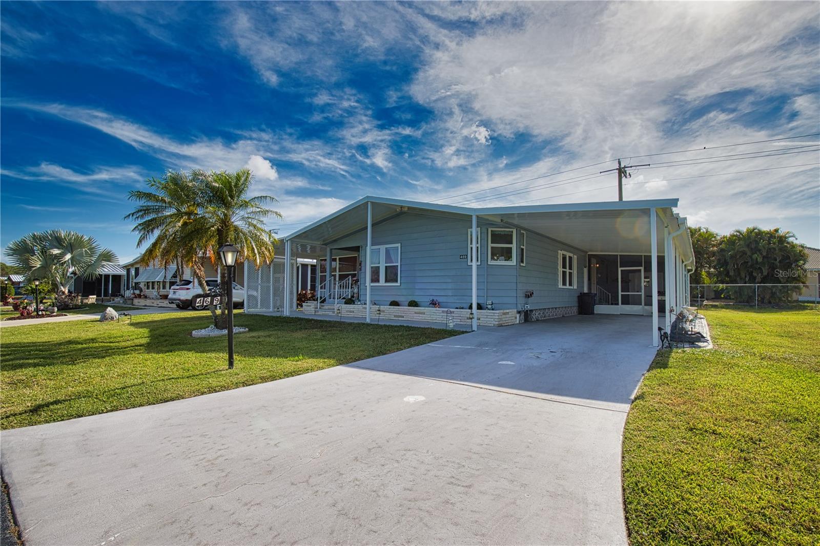 The ultimate lifestyle on Florida's Gulf Coast, located between Sarasota and Fort Myers with boat access to the Gulf. La Casa is a quiet 55+ community of 974 homes nestled among a variety of native trees. Spacious common grounds surround our eight lakes. Welcome To the Good Life! RECREATION, 2 Clubhouses, 2 Heated Pools. There is no shortage of activities in this community! Entryway w/washer, dryer, desk and skylight. Dining room w/built-in hutch and new light fixture. Remodeled kitchen w/loads of new cabinets, granite counter tops, stainless appliances and sky light. Morning room off kitchen w/table and chairs. Living room w/large-screen T.V. and door to the front porch and covered walkway opens to a glass enclosed Florida room. Guest bedroom w/ furniture and walk-in closet. Guest bath w/vanity, tub/shower, skylight. Upper and lower cabinets and linen chest located in the hall. Primary bedroom w/double walk-in closet. Primary bath w/double-sink vanity, double, walk-in closet, walk-in shower, linen chest and skylight. New windows. Vaulted ceilings throughout. Luxury laminate flooring throughout. Long carport to a screened lanai. Large 10' X 12' Utility room w/storage. New roof over the walk-way to the Florida room and golf cart covered parking spot. Many upgrades to this lovely La Casa home.