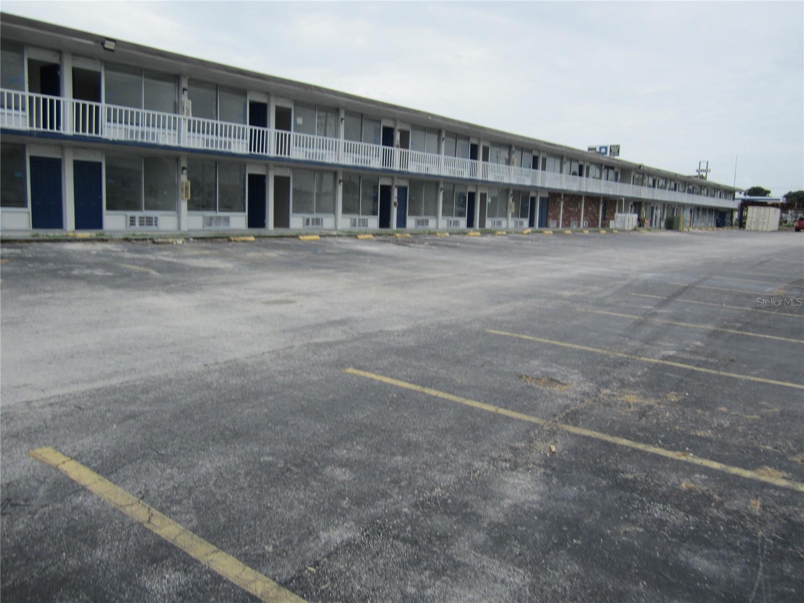 This building is 116 unit hotel/apartment complex: building is two-story concrete block/brick: second floor is concrete: each unit is 300 ft.² MOL efficiency apartments: new roof in 2024: building is being totally remodeled and has land to build on an additional 100 units MOL: you can rent these units by the day, week, month, or year: if you rent by the week at $350 per unit proforma income is $2,111,200 with the expenses at $844,480 and your net income will be $1,266,720. Total Acreage - 5+ acres