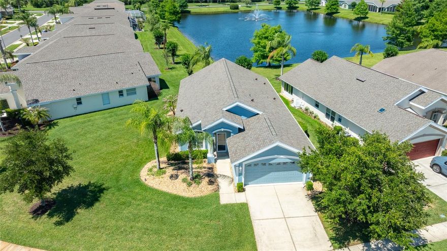 One or more photo(s) has been virtually staged. Beautifully situated home within the highly sought-after maintenance-free gated Villages of Royal Palm, this well-maintained 3-bedroom, 2-bath home with a 2-car garage offers peaceful LAKEFRONT living with wide water views and a serene natural backdrop. Located on a pie-shaped lot with a wide frontage, the home enjoys exceptional spacing between neighboring properties. This creates added privacy and a more open feel while still capturing long, unobstructed lake views. The home sits on higher elevation and remained completely unaffected during Hurricane Ian, with water coming nowhere close to the property, offering strong peace of mind. Furniture may be negotiable. Recent major improvements include a NEW ROOF installed in early 2025, along with updated A/C and water heater systems for comfort, efficiency, and long-term value. Inside, a natural color plank tile floor runs throughout the main living areas, including the foyer, kitchen, dining area, and family room. This creates a clean, cohesive flow. The kitchen layout has been opened up to improve natural light and connection to the main living space. Quartz countertops add a fresh, modern finish. The family room opens to an enclosed Florida room through upgraded sliding glass doors. This space is filled with natural light and is perfect for relaxing while enjoying LAKEFRONT views year-round. Both bathrooms have been tastefully updated. The guest bath features a walk-in shower conversion. The primary bath includes an updated tiled shower. The three bedrooms are carpeted and in good condition, with carpeting replaced around 2012. Located in the secure Villages of Royal Palm in Port Orange, residents enjoy true maintenance-free living with excellent amenities and convenience. HOA services include lawn care, landscaping, pest control, sprinkler maintenance, Spectrum cable and internet, exterior painting, and annual pressure washing. Community amenities include two pools (one heated), whirlpool spa, fitness center, pickleball and tennis courts, basketball court, putting green, shuffleboard, bocce ball, billiards, library, crafts room, and a beautifully appointed clubhouse with ballroom, catering kitchen, covered lanai, and a full calendar of activities. Just minutes from shopping, dining, hospitals, medical facilities, interstate access, and the beach, this home offers comfort, upgrades, LAKEFRONT living, and low-maintenance Florida lifestyle, ideal for full-time residents or seasonal snowbird living.