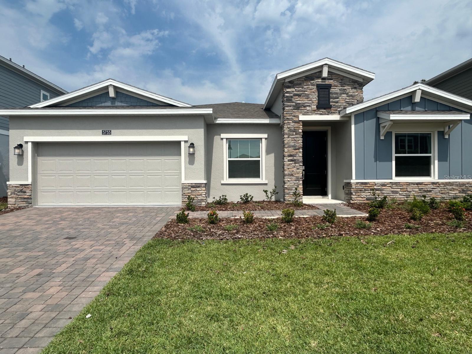 This New home is a Single Home , one story, back to conservation with four bedrooms, three full bathrooms, and a three-car garage, the property has two extra rooms for versatile needs. The open space layout in the kitchen, dining room and family room extends to the lanai through sliding glass doors for outdoor living. The owner's suite has a spa-inspired bath and two expansive walk-in closet. In the Kitchen you can notice quartz countertops, stainless steel appliances and cabinets. This property is located in Bridgewalk Community, great location close to Lake Nona. Great Restaurants and shopping Center. Great Schools. The Community has a Club House resort-style swimming pool, fitness center, playground, basketball & volleyball courts
