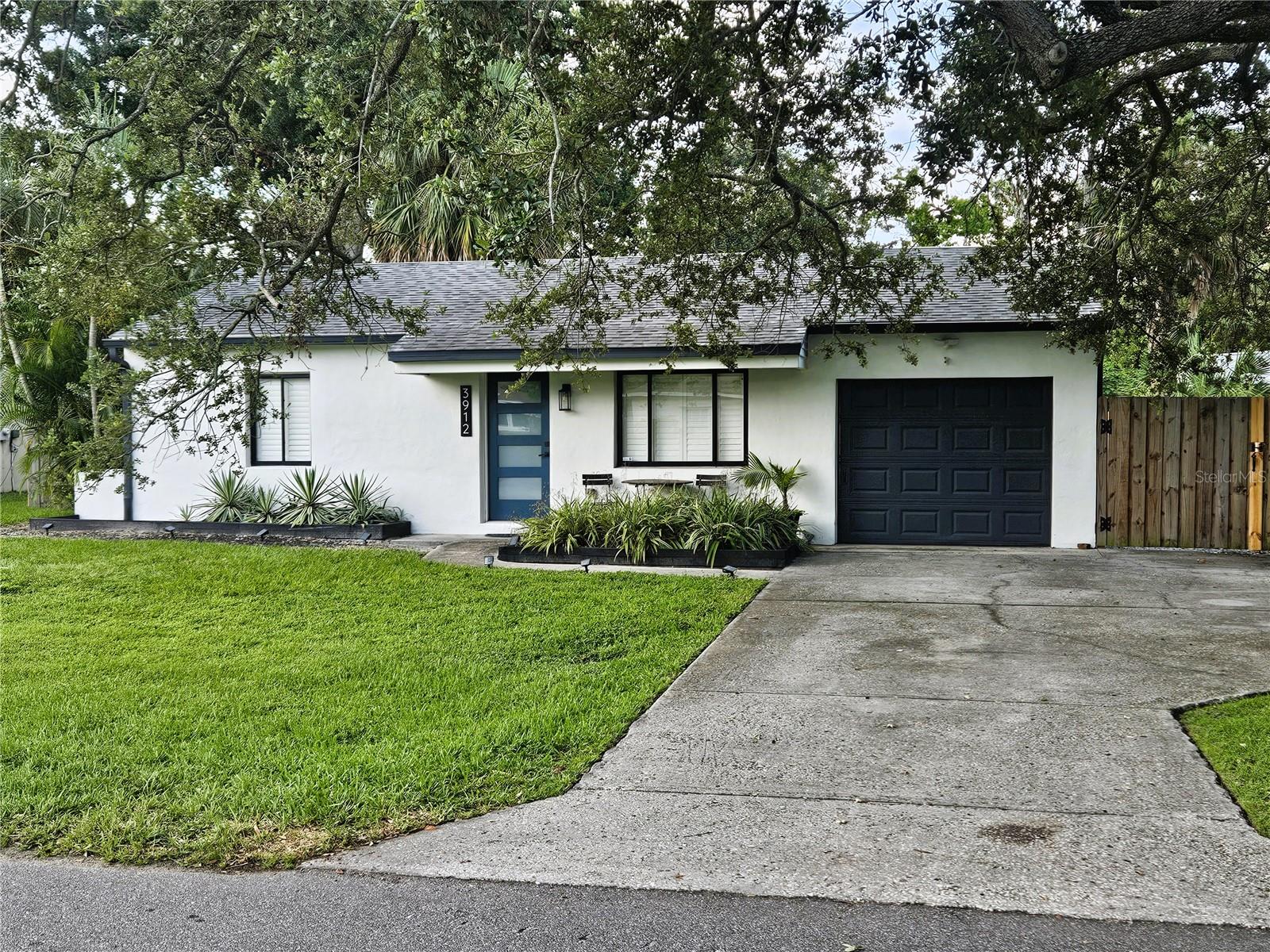 Awesome South Tampa Location, Large Fenced Yard, and Space for a Boat. Move-in Ready Updated 2 Bedroom, 1 Bathroom Home in the Fairlawn Estates Community of South Tampa. Maintenance-free Wood Tone Vinyl Plank Flooring and Plantation Shutters are installed throughout the entire Home. The Chef’s Dream Kitchen opens to the Living Room with plenty of Recessed Lighting. The Kitchen has Stainless Steel Appliances, a Decorative Tile Backsplash, a Large Double Sink, Quartz Counters, Wood Cabinets, and a Waterfall Island with Storage and space for Barstools. Both Bedrooms are in perfect condition, have Double Closets, Crown Molding, and share an updated Bathroom with Shower. The Family Room is at the back of the Home. The Vaulted Ceiling, multiple Windows, and Glass Sliders make this area feel Light and Bright. A Laundry Room with Washer/Dryer and Shelving is behind the Sliding Barn Door. You will spend many hours relaxing and entertaining under the Covered Patio and in the oversized newly Fenced Backyard. The Property has a 1 Car Garage with an extra Storage Room in the rear. Additional Cars or a Boat can be parked on the right side of the Home behind the Double Door Gate. Pets (2) permitted (pet screening and owner approval are required). $350 non-refundable pet fee for each pet. The property is Professionally Managed and Maintained. There is a one-time $150 Administration Fee and $75 Application Fee for each applicant 18 years or older. Applicants should have a minimum 600 Credit Score, Gross Monthly Income of at least 2.5 times the Monthly Rent, and stable Rental History (no Evictions or Tenant Collections).