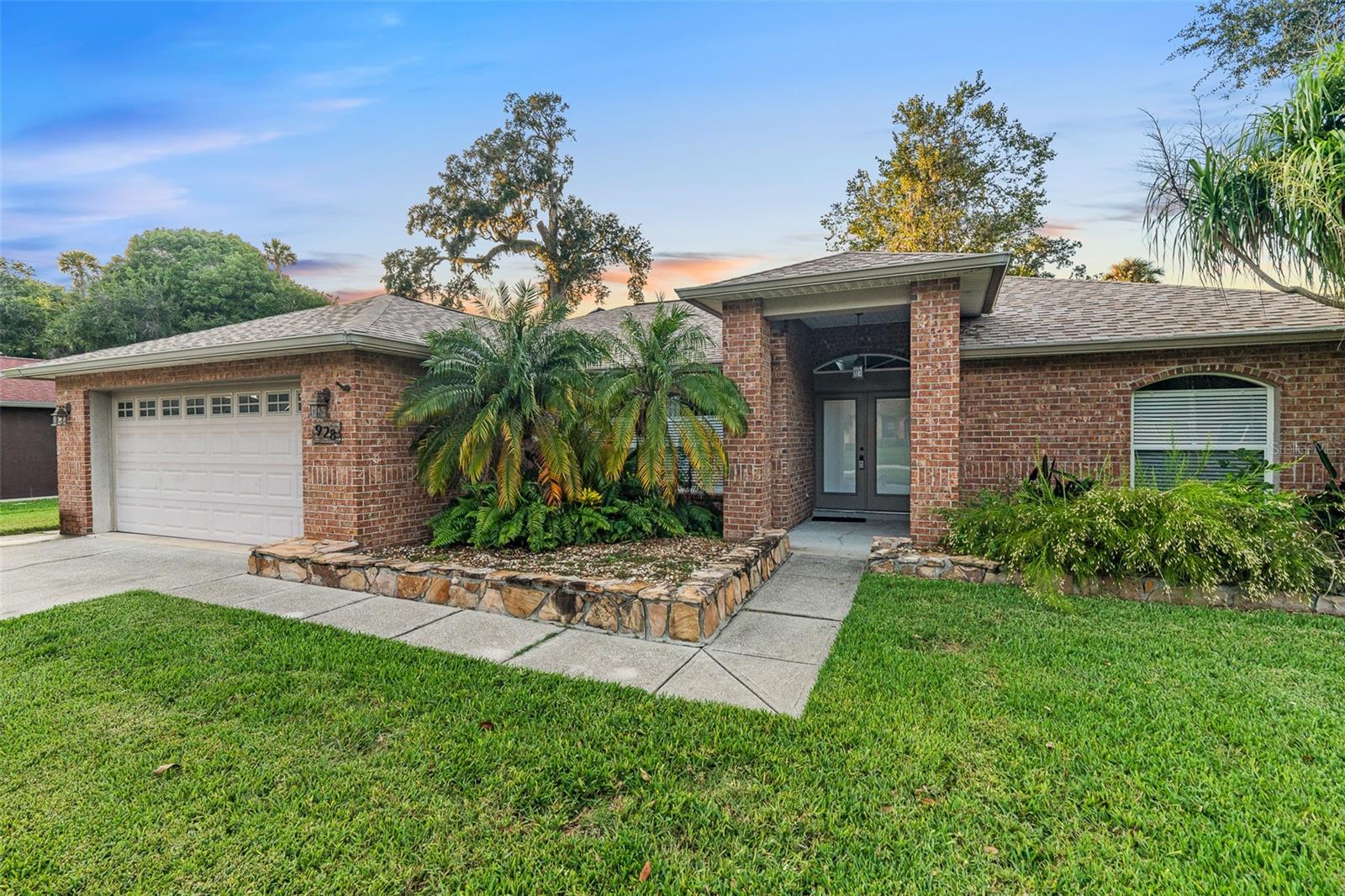 BRAND NEW ROOF & VINYL FENCE! Discover this move-in ready treasure tucked away in the highly sought-after Bryan Cave Estates, right in the heart of South Daytona. Ideally located just minutes from top local attractions and under four miles from the drive-on beaches of Daytona, this home offers the perfect blend of serenity and convenience. As you enter the neighborhood, you’ll be greeted by beautifully maintained homes, scenic walking paths, and streets framed by majestic oak trees—a true sense of community pride is on display. The home's curb appeal is undeniable with its brand-new roof, lush landscaping, and spacious driveway making a striking first impression. Inside, you'll find a freshly painted interior with a bright, open split floor plan designed for modern living. The kitchen is both stylish and functional, featuring rich cabinetry, stainless steel appliances, and ample prep space. A cozy breakfast nook overlooks the large, newly fenced backyard—ideal for peaceful mornings or weekend brunches. The primary suite offers a relaxing escape with a tray ceiling, a walk-in closet, and a spa-inspired en-suite bath complete with a soaking tub and separate shower with a built-in seat. Step out into the screened lanai for year-round enjoyment while watching the kids or pets play freely in the private backyard. Just a short stroll to Reed Canal Park, this home is perfectly positioned for both nature lovers and those looking for easy access to shopping, dining, and the beach. Homes like this don’t come along often—schedule your private showing today before it’s gone!
