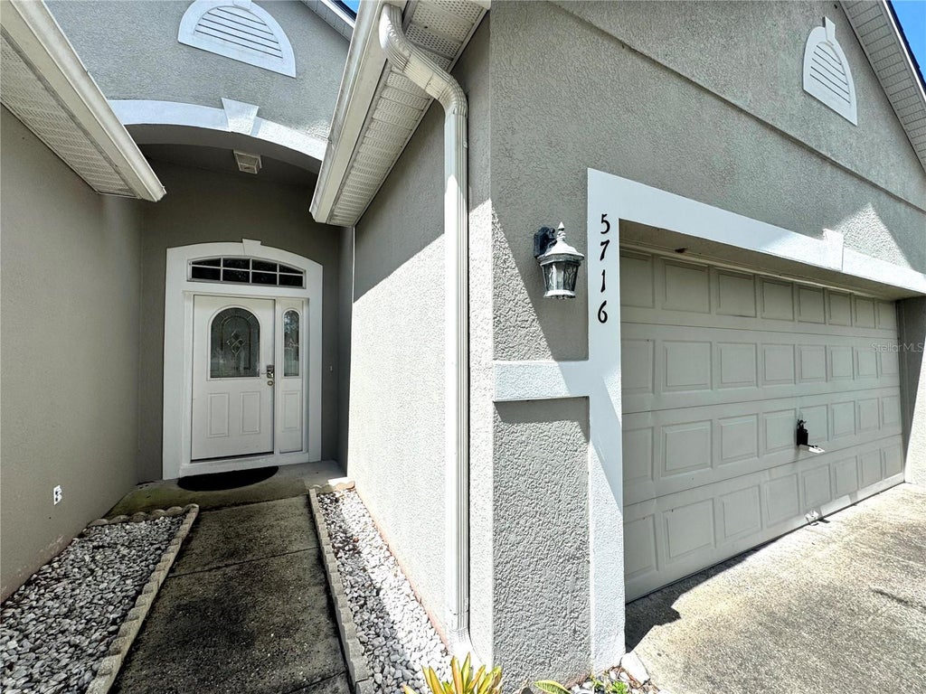 Photo of 5716 Port Concorde Lane, Orlando, FL 32829 (MLS # O6441716)