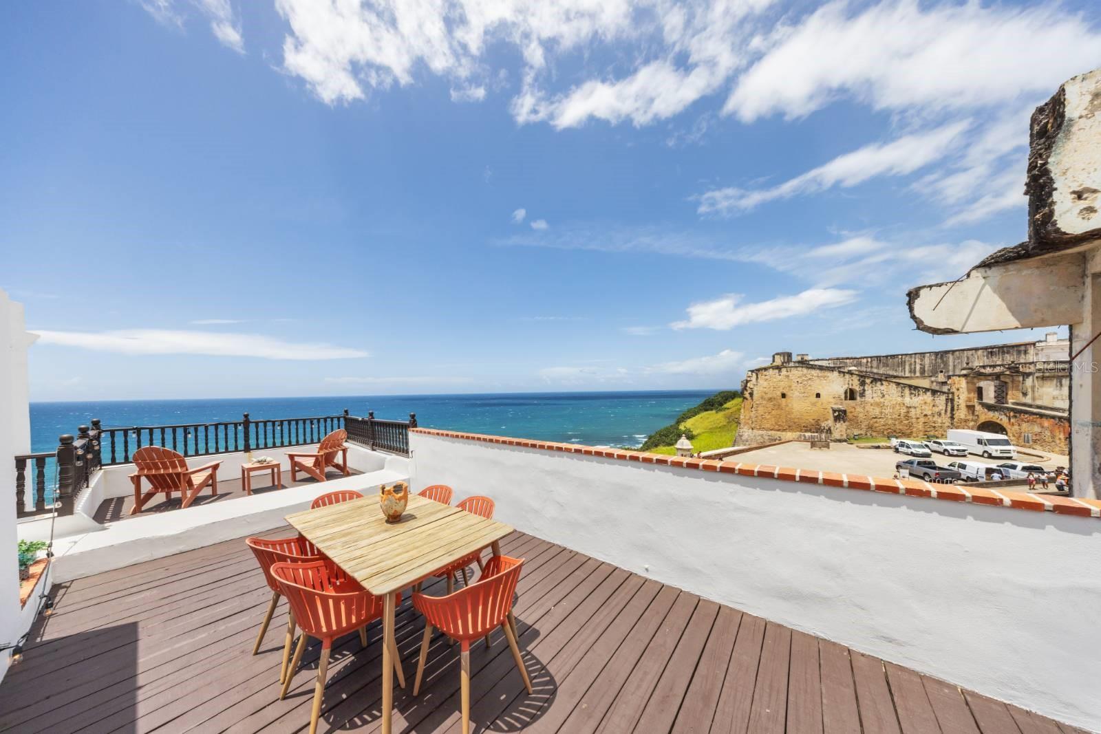 Historic Colonial Home with Ocean Views on Norzagaray Street, Old San Juan
Approx. 2,500 SF | 2 Beds | 3 Baths | Rooftop Terrace | Dual Access
Located on iconic Norzagaray Street in the heart of Old San Juan—steps from San Cristóbal Fort—this rare three-story colonial residence offers panoramic Atlantic Ocean views and unmatched character. Originally built in the 1600s and thoughtfully restored, the property blends historical charm with modern comfort.
Key Features:
Approx. 2,500 SF of total living and outdoor space
Dual private access from Norzagaray and Sol Streets
First Floor: Living room, family room, kitchen, full bath, and interior patio with ocean views
Second Floor: Two spacious bedrooms, both with en-suite bathrooms; the primary suite includes ocean-facing balcony and walk-in closet
Third Floor: Expansive rooftop terrace with panoramic views of San Cristóbal Fort, the city walls, and the Atlantic
Additional Space: 1800s stone water cistern with potential for conversion (wine cellar, office, studio)
Cathedral ceilings and marble floors sourced from Juana Díaz, PR
Exceptional cross-ventilation and natural light throughout
Zoned for residential use with short-term rental potential; eligible for historic district tax incentives
Location Highlights:
Situated within a UNESCO World Heritage Site, this home is walkable to Old San Juan’s best restaurants, shops, historic sites, and cultural venues. A short drive connects you to Condado, Miramar, and the airport (SJU).