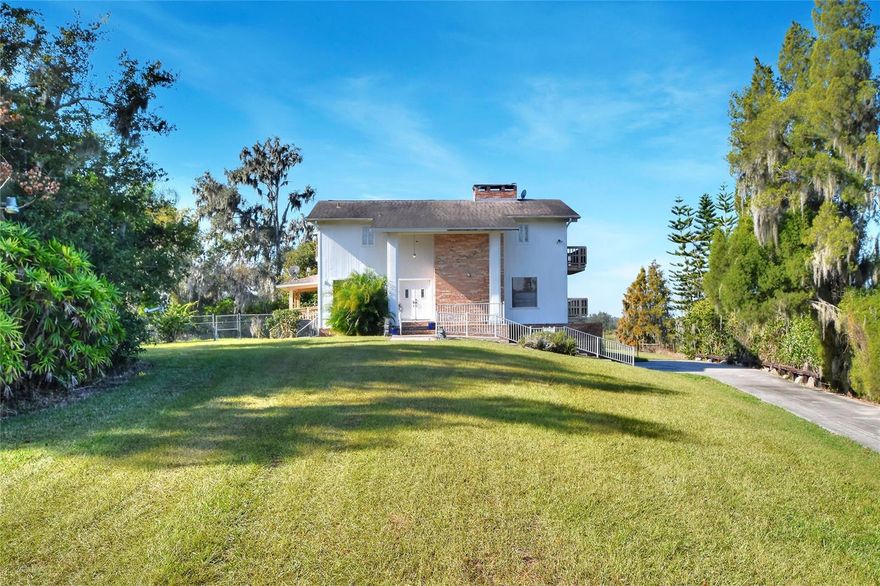 Tremendous potential awaits on this secluded 20-acre parcel located along State Road 60 between Plant City and Brandon. The 1988-built, 2,107-square-foot home features a unique three-story layout with a ground-level garage and a wood-burning fireplace. While the home is functional, it is ready for updates—offering an excellent opportunity to renovate, customize, or repurpose. The expansive acreage provides ample space for animals, equipment, and outdoor activities, all while benefiting from convenient highway access. Ideal for agricultural use, recreation, or a rural lifestyle with room to grow.