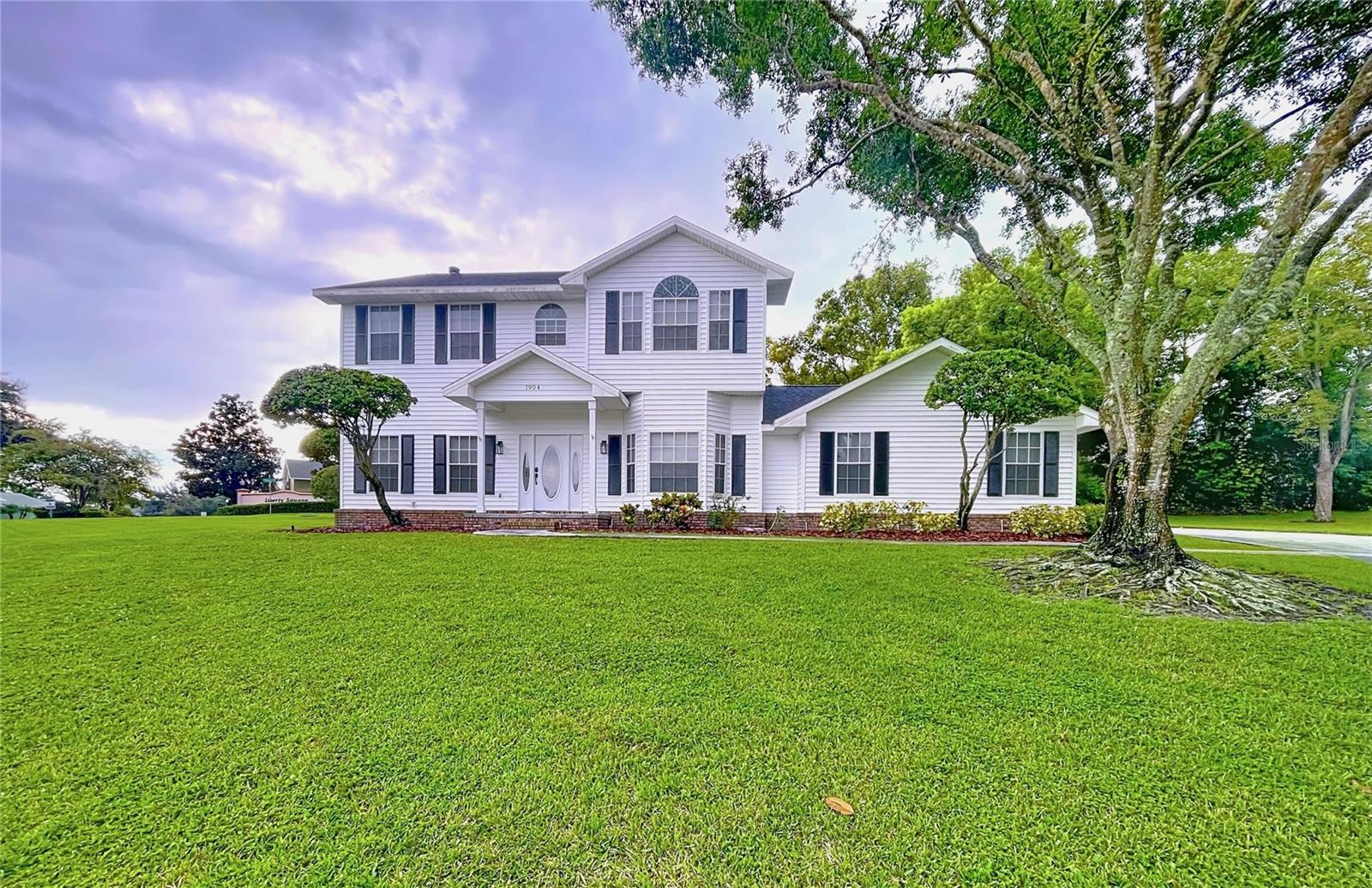 Nestled in the heart of Lakeland’s highly sought-after 33813 zip code, 1904 Vista View Drive is a beautifully renovated residence that perfectly blends timeless elegance with everyday functionality. Boasting a spacious and thoughtfully designed floor plan, this home is where formal style seamlessly meets practical living—ideal for large families or those who love to entertain. From intimate dinners to large gatherings, the open layout offers versatility and comfort in every corner.
Step outside and discover one of the home's standout features: a large, fully enclosed rear screen room that spans the entire length of the home—perfect for relaxing bug-free evenings, morning coffee, or entertaining guests in any weather. Just beyond, an additional concrete patio area provides the ideal spot for barbecue grilling, a fire pit, or outdoor dining—all set within your private, fenced backyard, offering both space and seclusion for unforgettable gatherings with family and friends.
Recent top-to-bottom updates bring peace of mind and contemporary charm, including a brand-new roof, stylish new flooring, updated cabinets and countertops, fresh interior paint, new vinyl siding, and modern light fixtures throughout. Set on a generous half-acre lot, the expansive backyard provides ample room for outdoor activities, gardening, or even adding a pool.
An oversized side-entry garage and expansive driveway offer abundant parking and storage space, while the home's location on a quiet cul-de-sac enhances the sense of peace and privacy. This move-in-ready gem combines upgraded living with a prime location close to top-rated schools, shopping, dining, and everything Lakeland has to offer.