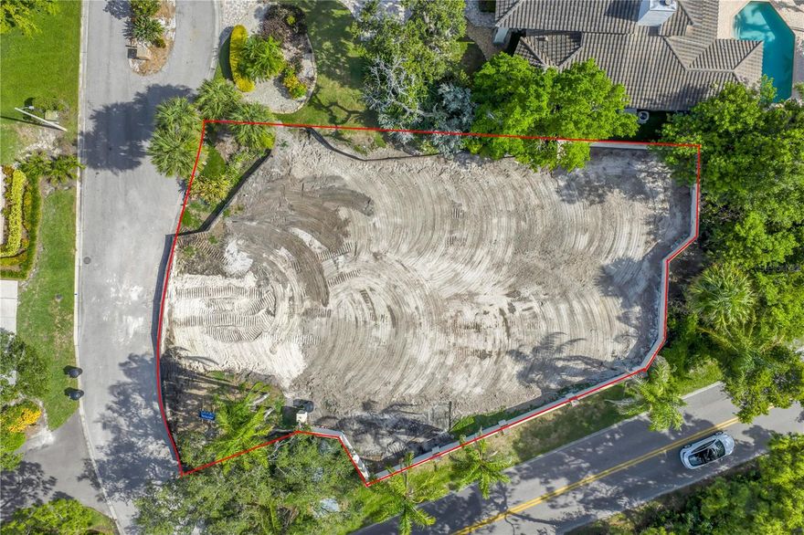 Take advantage of this RARE CHANCE to build your dream home on a spacious, nearly half-acre lot in one of only two gated communities in Northeast St. Petersburg—Placido Bayou. This exclusive, guard-gated neighborhood offers a tranquil lifestyle with scenic lakes, walking and running paths, and mature trees that provide natural beauty and shade. Twelve tall palm trees add significant ambiance to the property. Ideally located just minutes from downtown St. Petersburg’s vibrant waterfront, you'll enjoy world-class dining, boutique shopping, art galleries, museums, and more. The community is close to top-rated schools, stunning beaches, airports, and premier golf courses. Plus, the St. Petersburg Racquet Club is right at the entrance, offering top-notch tennis and pickleball facilities. Don’t miss this rare opportunity to build your custom home in one of St. Pete’s most sought-after and secure neighborhoods—Placido Bayou.