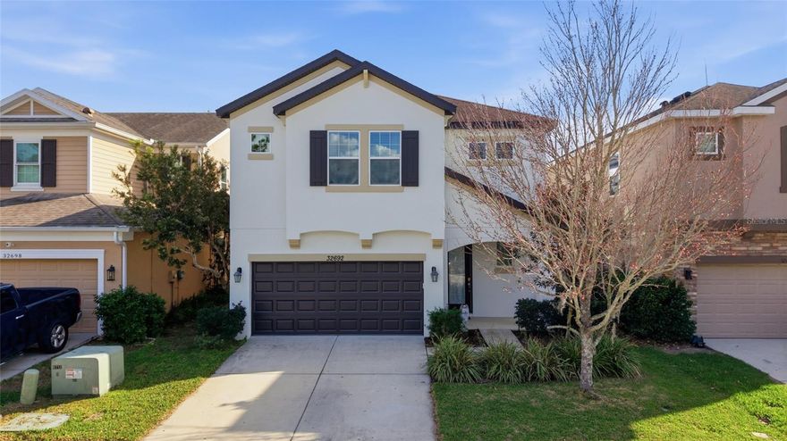 Beautiful 3-bedroom, 2.5-bath home in Watergrass, Wesley Chapel. Two bedrooms feature walk-in closets, and the first-floor half bath adds convenience. The open floor plan flows from the kitchen, with 42-inch cabinets and walk-in pantry, to the living and dining areas. Sliding glass doors open to a covered lanai and fully fenced backyard, perfect for the whole family. Fresh interior and exterior paint, along with new flooring, make this home move-in ready.

Upstairs, a spacious loft can serve as an office, game room, or theater. The primary suite features dual sinks, a tub, walk-in shower, and a private toilet room. Additional highlights include a 2-car garage with extra parking, and community amenities across the street: clubhouse, pool, fitness center, tennis courts, and playground. Minutes from Epperson Lagoon, schools, shopping, and everyday essentials, comfort and convenience all in one home.