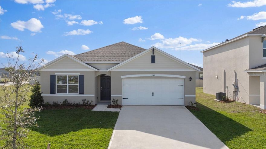 4-bedroom, 2-bathroom home with a 2-car garage and 1,882 sq ft of living space. The open floor plan seamlessly connects the living, dining, and kitchen areas—perfect for entertaining. The kitchen features quartz countertops, stainless steel appliances, a walk-in pantry, and a spacious island. The primary suite offers a private ensuite with dual sinks, a walk-in shower, and a walk-in closet. Three additional bedrooms share a full bath. A convenient laundry room and smart home technology add to the modern appeal.