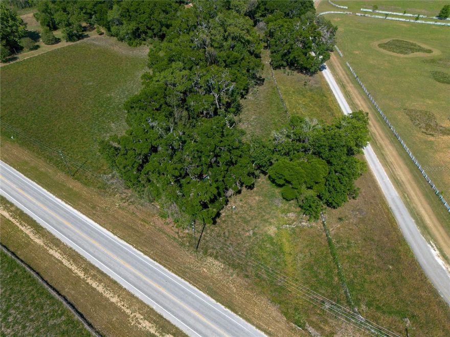 Amazing 1 acre lot that is just 1/2 mile to Santa Fe High School, Publix and so close to everything!  There is an 1196 SF, 4 bedroom 2 bath manufactured home on the site as well.  But the true value is in the land and the prime location.  Only 15 minutes to Gainesville and about 3 minutes to downtown Alachua, the property is just adjacent from the Tower Hill Insurance Headquarters.  It's so rare to find a lot with no builder restrictions in such an accessible location.  Plumbing, electrical and more already on the property.