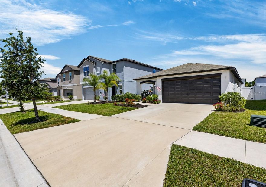 This meticulously maintained 3 bedroom, 2 bath home with 2 car garage is located in the desirable South Creek community of Riverview! Built in 2022, this home offers an open concept floor plan, modern design, energy efficiency, and functional living spaces perfect for everyday living and entertaining. Step inside to find a spacious open layout featuring a stunning kitchen complete with granite countertops, stainless steel appliances, a gas stove, and a large center island. Natural gas services the stove, tankless water heater, and dryer, adding both efficiency and convenience. The spacious primary bedroom serves as a relaxing retreat and features an en-suite bath with dual vanities, walk-in shower, and a large walk-in closet. The split-bedroom floor plan provides privacy and comfort for family members and guests alike. An irrigation system helps keep the welcoming landscaping lush year-round. The fully fenced backyard is designed for entertaining with a large 12x24 patio—perfect for birthday parties, barbeques, family gatherings, or simply relaxing outdoors. Since the home was built in 2022, all major components are only 4 years old, offering peace of mind for years to come. Residents of South Creek enjoy access to fantastic community amenities including a pool, playground, and clubhouse, all conveniently located near shopping, dining, entertainment, and major commuter routes including US 301 and I-75. Gorgeous Florida beaches, airports, and theme parks are just a short drive away! Schedule your showing today!