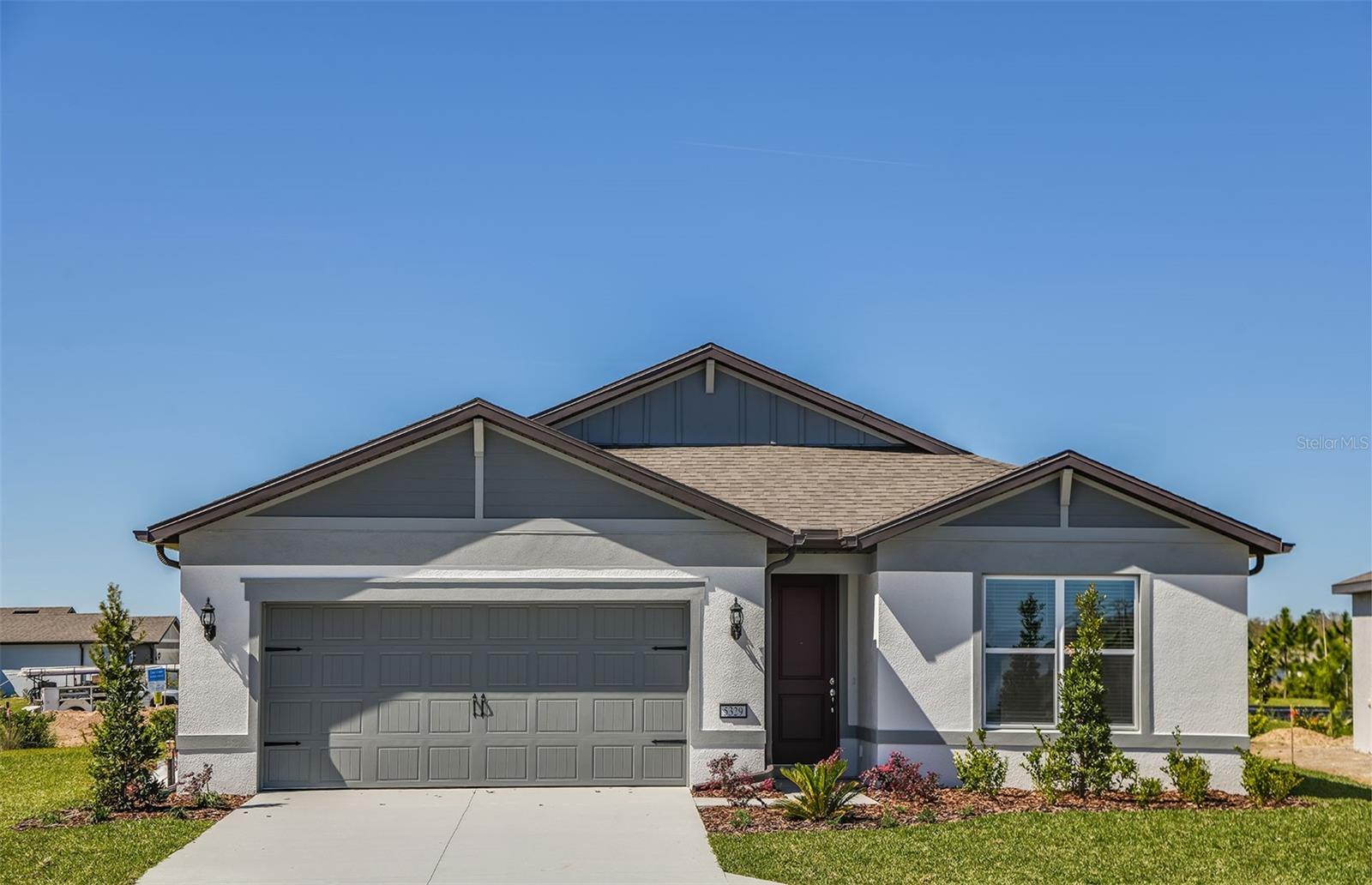 One or more photo(s) has been virtually staged. Move In Ready Available NOW!! Enjoy all the benefits of a new construction home in the serene setting of Ocala, FL's horse country, with an age-restricted, fully amenitized lifestyle at Del Webb Stone Creek. This is the active adult community you've been looking for, with amenities that include an 18-hole championship golf course, a full restaurant and bar, indoor and outdoor pools, sports courts, and so much more. Our sprawling amenities, clubs, and classes will fill your retirement days with activities to make new friends and memories.
This popular Cresswind floor plan, with an open-concept home design, has all the upgraded finishes you've been looking for. The designer kitchen showcases a spacious center island with a large, single-bowl sink, white cabinets, 3cm quartz countertops with a 3”x6” white herringbone tiled backsplash, and Whirlpool stainless steel appliances, including a refrigerator, microwave, range and dishwasher.
The bathrooms have matching white cabinets, 3cm quartz countertops, and comfort-height commodes. The owner's bath has dual sinks and a walk-in shower with a bench seat and upgraded glass door. Luxury vinyl plank flooring is in the main living areas, 22”x22” tile is in the baths and laundry room, and stain-resistant carpet is in the bedrooms.
This home also features a convenient laundry room with Whirlpool washer and dryer, a covered lanai, a large kitchen pantry, and a 2-car garage with a utility sink and a 4’ extension.
Additional upgrades include 4 LED downlights in the gathering room, pendant prewiring in the kitchen, upgraded door hardware, whole house blinds and a Smart Home technology package with a video doorbell.