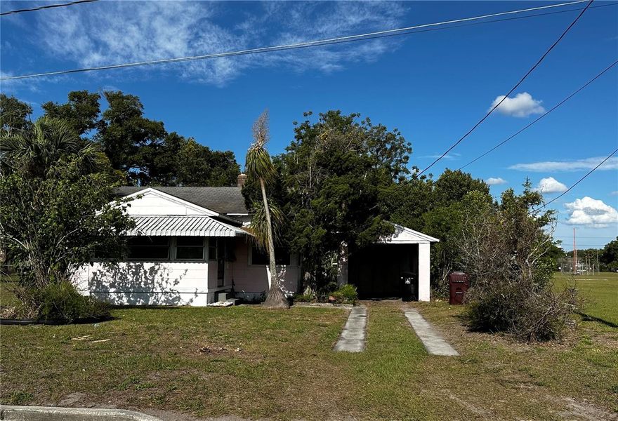 This home is pretty much a knock-down, but the lot is large and flat.  It is located adjacent to a large swath of vacant land owned by City of Orlando/GOAA.  The power and water are off at this point.
