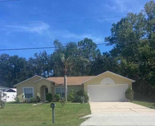 Photo of 94 Bird Of Paradise Drive, Palm Coast, FL 32137 (MLS # V4951008)