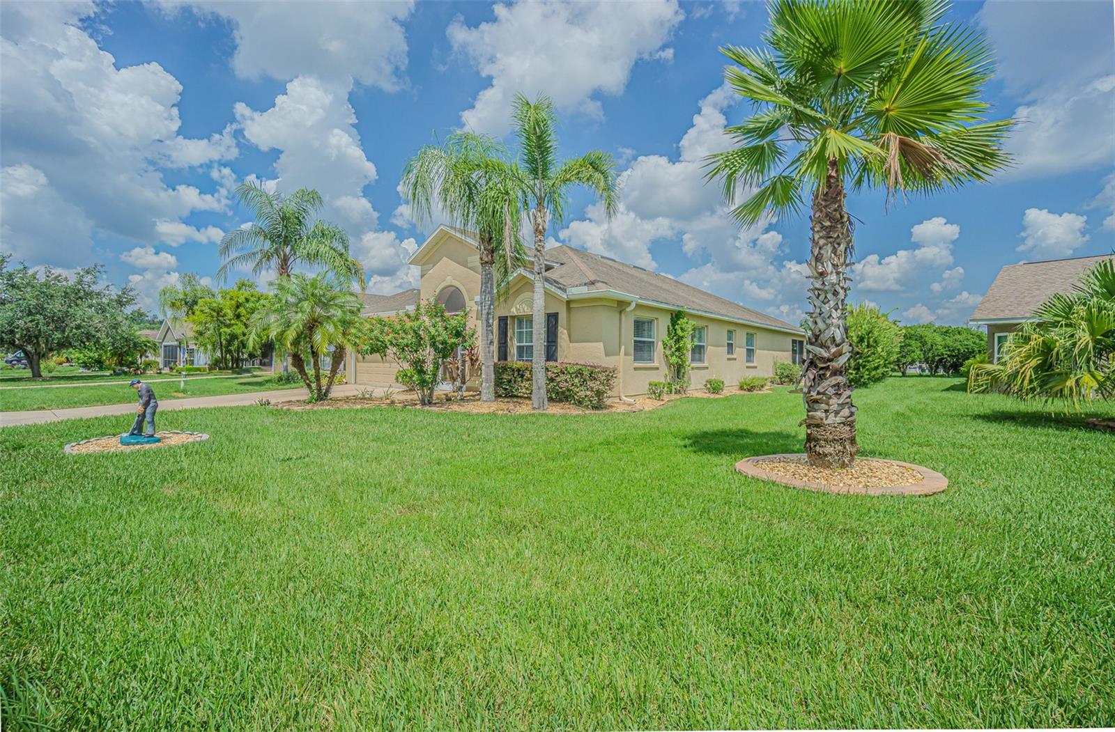 STUNNING REMODELED HOME, with over $40,000 in recent upgrades, is MOVE-IN READY! Welcome to this beautifully updated 2,065 sq. ft. home in the highly desirable 55+ Tampa Bay Golf & Country Club, offering 3 bedrooms, PLUS office/den that can double as a 4th bedroom, 2 baths and Extended lanai. From the moment you arrive, you’ll be impressed by the curb appeal—lush, manicured landscaping, epoxy-coated driveway and walkway, and a screened front entry that invites warm Florida cross breezes. Once inside, you will be impressed with the soaring vaulted ceilings, freshly painted interiors, new lighting, Plant shelves and abundant natural light from large double windows. The Light, Bright and OPEN formal living and dining areas are perfect for entertaining, with chairrail, tall baseboards and new LVP (Luxury Vinyl Plank) flooring flows throughout the main living spaces and office. The heart of the home is the gourmet kitchen, featuring GLEAMING countertops, undermount sink, all-new cabinetry with designer hardware, a center island, breakfast bar, and cozy dinette overlooking the sideyard lawn. The kitchen opens directly to the great room, where built-in custom pantry closet, arches, and niches add custom character. The split-bedroom layout ensures privacy: the spacious primary suite boasts an enormous walk-in closet and a renovated bath with all new cabinets and counter-topped vanities, and a large walk-in shower with seat and grab bars. Secondary bedrooms are tucked away on the opposite side with their own updated bath. The den/office with double doors can easily serve as a 4th bedroom, guest room, or hobby space. The interior laundry room includes upper storage cabinets, and the garage features a painted floor and room for extra storage. Relax, REST EASY or entertain outdoors on the extended screened lanai, complete with a freshly resurfaced acrylic stone-chip floor, vaulted screen roof, and plenty of room for outdoor dining or gatherings. Living in TBGCC means enjoying a true RESORT Lifestyle in a man-guard gated community just off I-75 with easy access to Tampa, Ocala, Orlando, and the Gulf beaches. RESIDENT OWNED Amenities include: 2 swimming pools (one heated) RESORT style with fountains and lap lanes, the other adult only pool (unheated); Fitness center, Poker room & billiards room in Activities center; Award-winning clubhouse with full-service restaurant, pub/grille, and pro shop, Library, card rooms and banquet facilities; Championship golf (memberships available or pay-as-you-play), Pickleball, Tennis, bocce, cornhole, shuffleboard, onsite entertainment and travel excursions available; Dog parks and scenic ponds; Planned activities, dances, dinner shows, day trips, bingo, bunco, card clubs, and more! This home offers everything you’ve been looking for—modern updates, spacious design, and an active community lifestyle! 2 Seater, 2017 CLUB CAR golfcart,with all new batteries, is negotiable. CALL today to schedule your private showing and see why Tampa Bay Golf & Country Club IS the perfect place to BE!